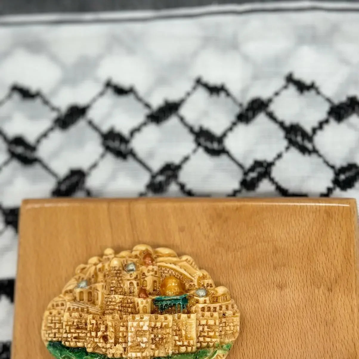 Handmade Palestine map wall art accessory by Palestinian Elegance featuring detailed golden cityscape on wooden base