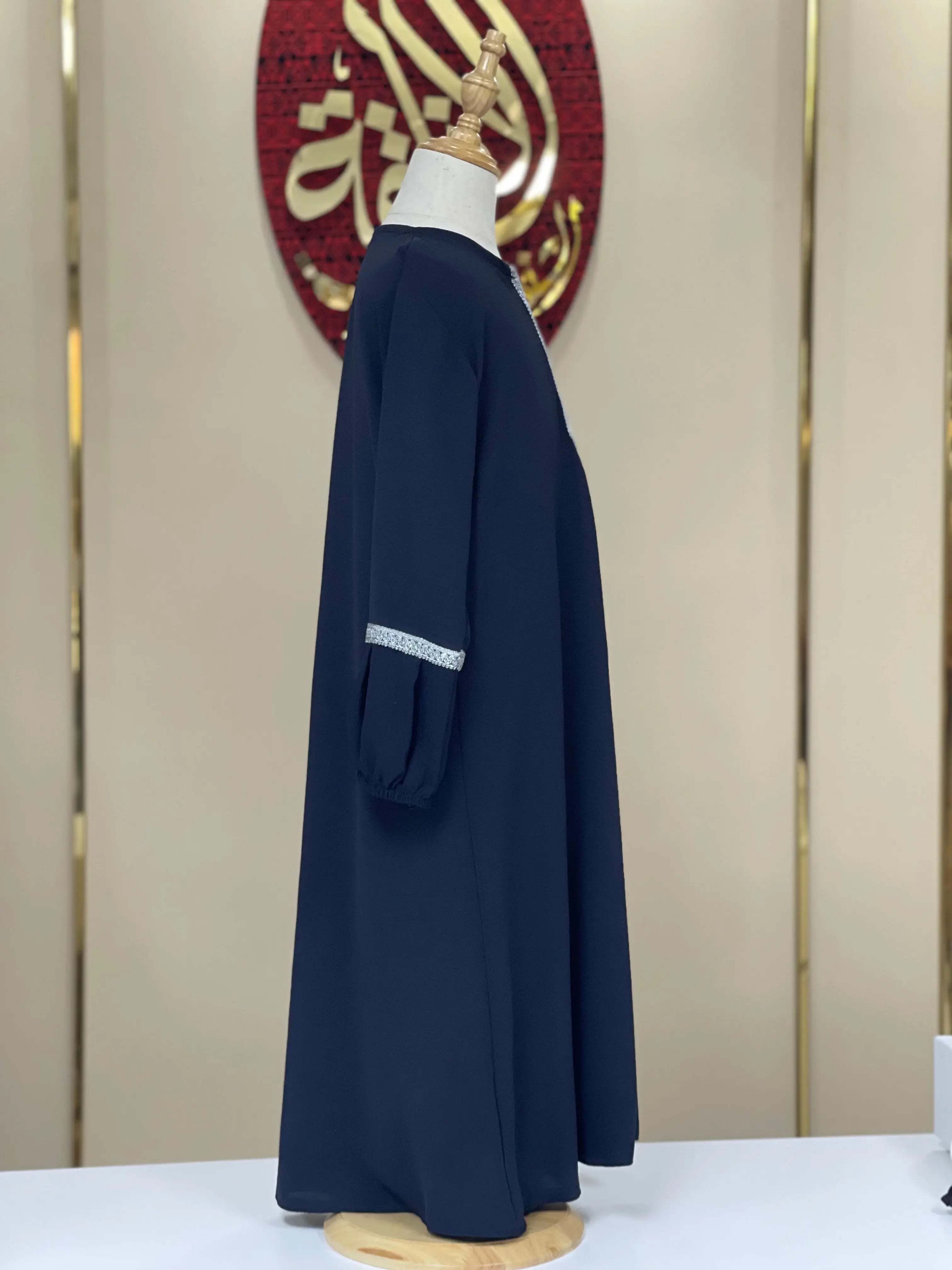 Palestinian Elegance girls embroidered abaya in navy blue with silver detail on sleeve cuff