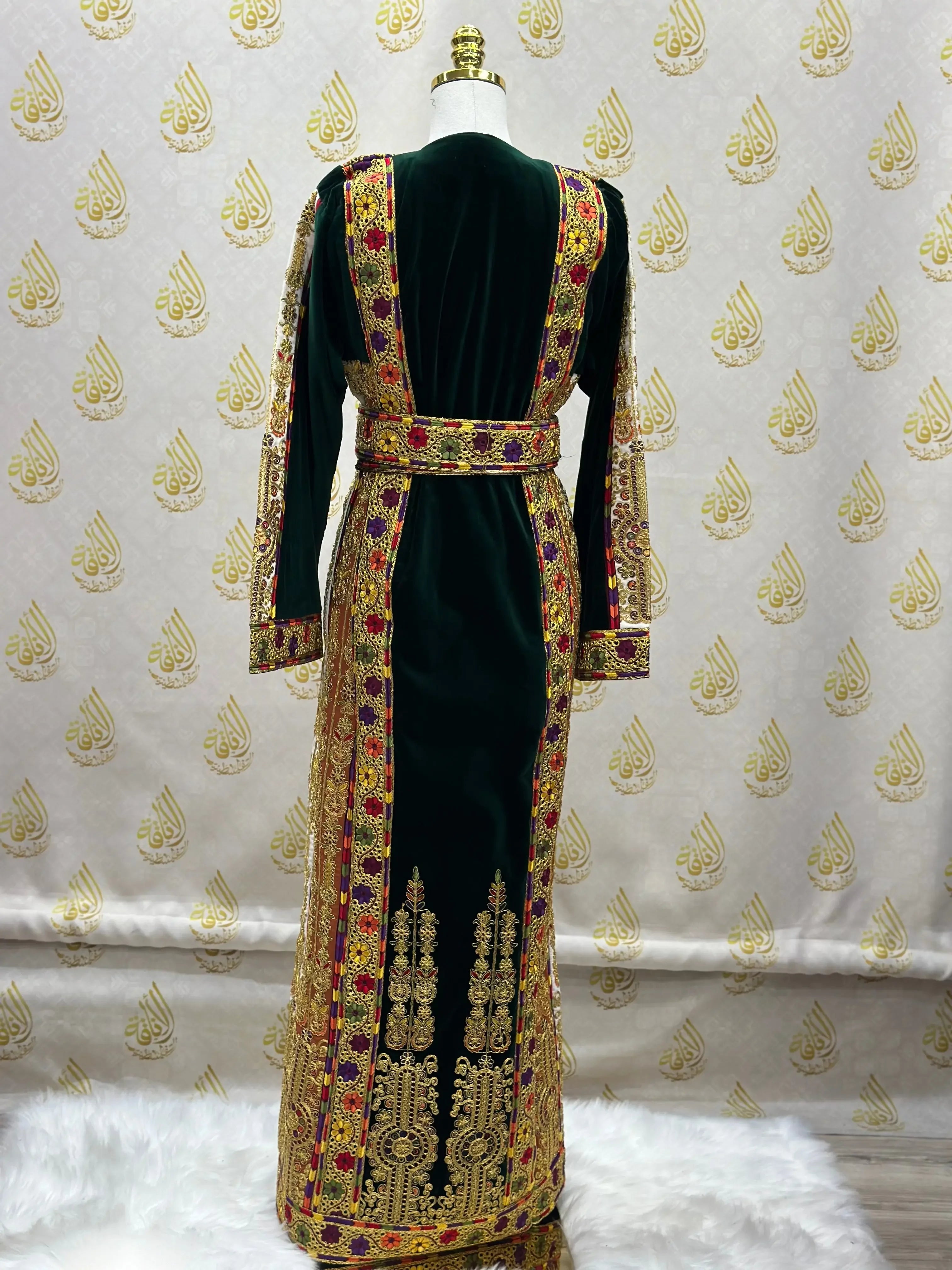 Velvet Palestinian dress with intricate gold and red embroidery by Palestinian Elegance