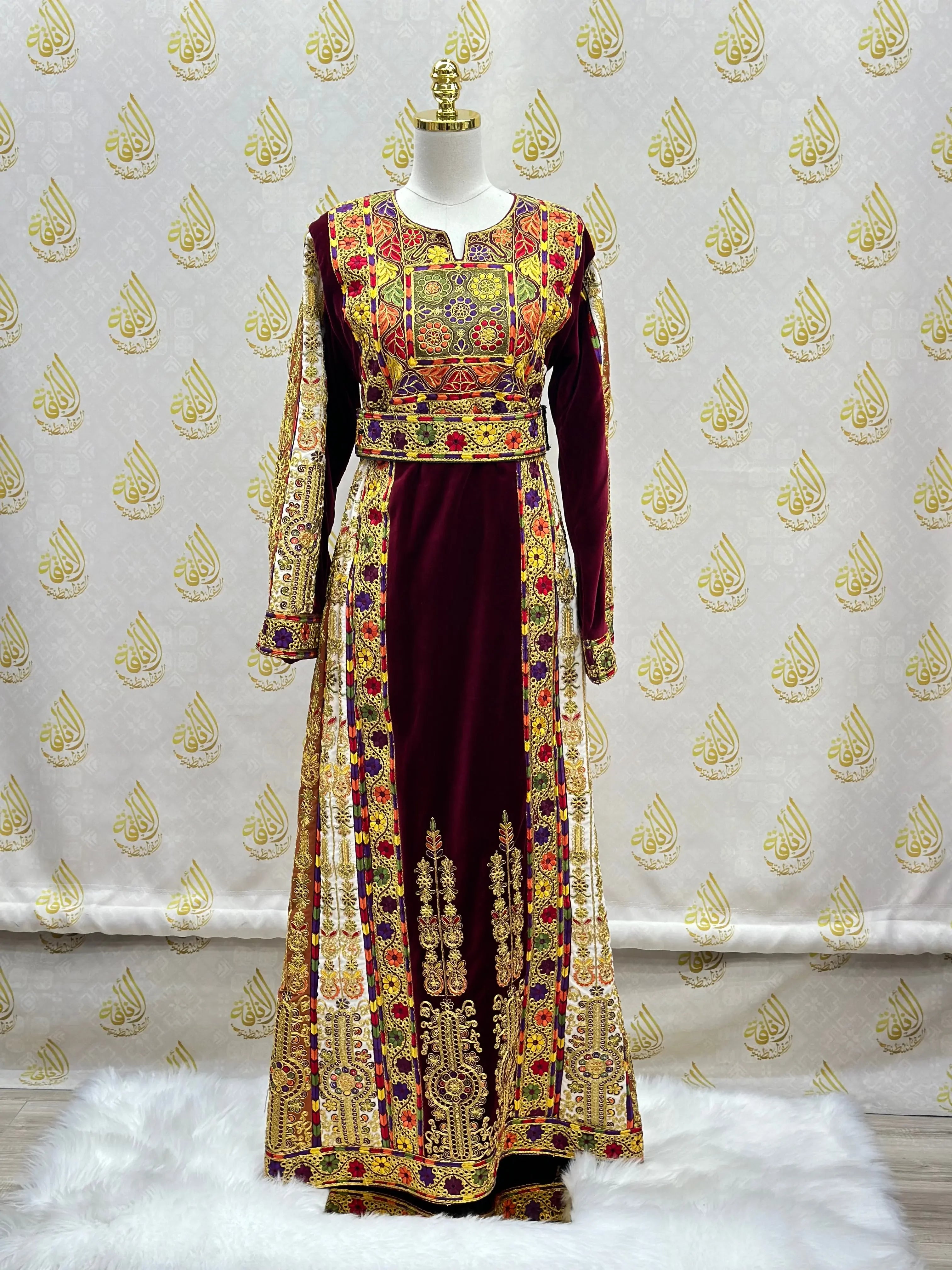 Velvet Palestinian dress with intricate embroidery by Palestinian Elegance displayed on a mannequin