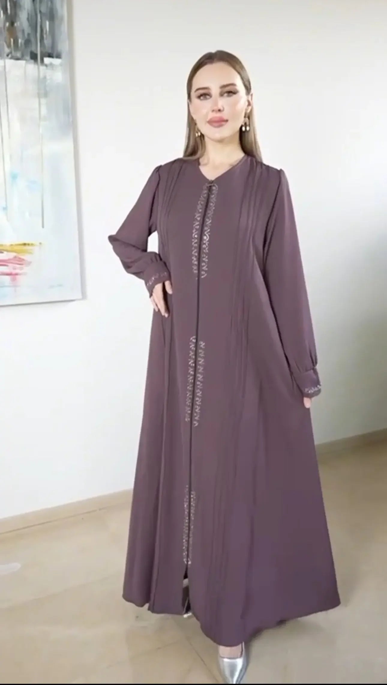 Palestinian Elegance modest abaya for women in a muted purple color with subtle decorative stitching