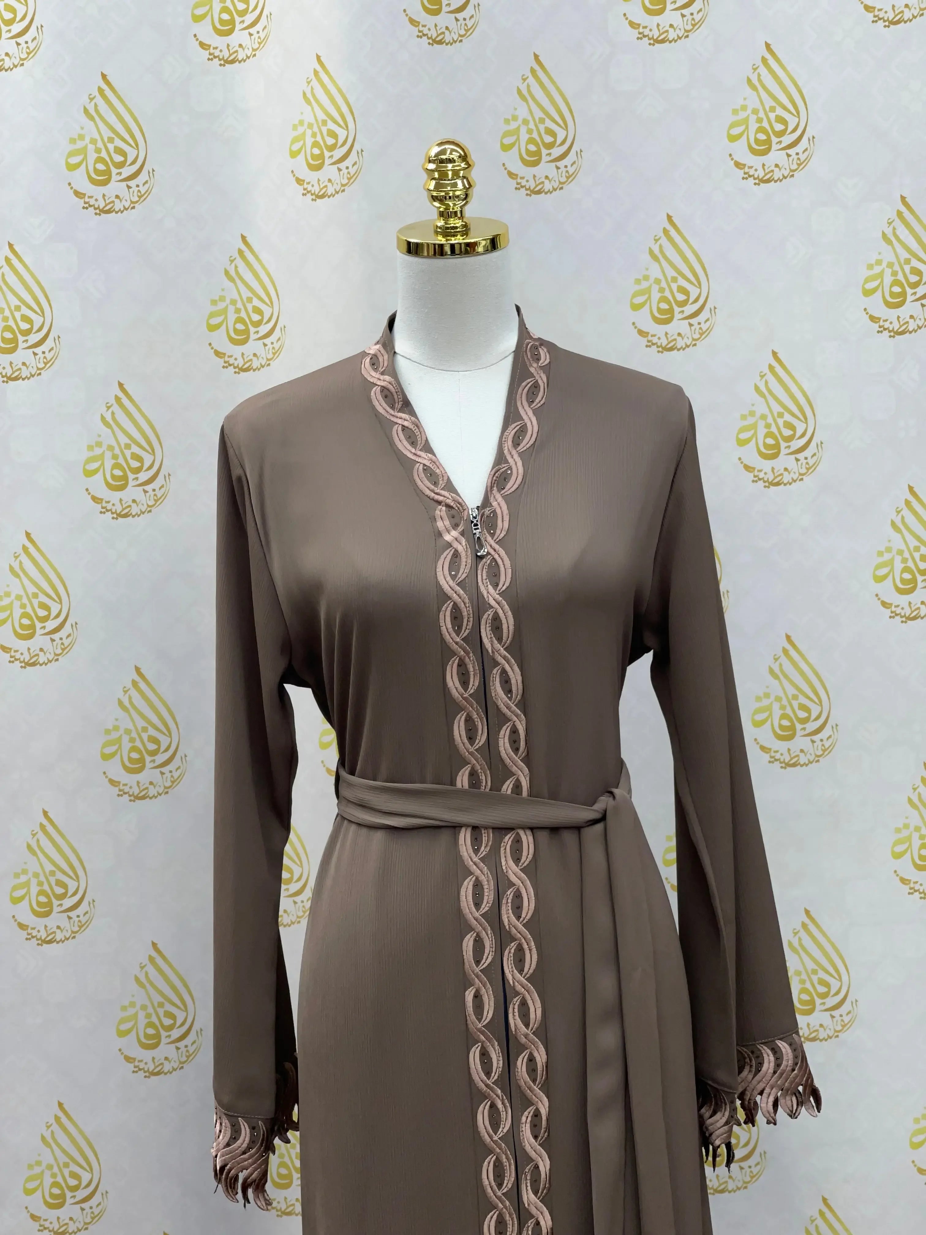Elegant embroidered abaya in brown with detailed trim and waist belt by Palestinian Elegance