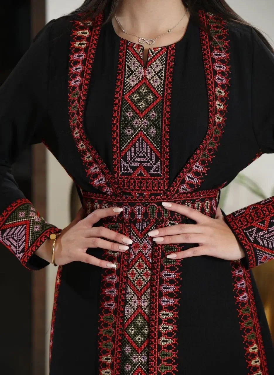 Palestinian Elegance embroidered abaya for women in black with intricate traditional red and pink embroidery patterns