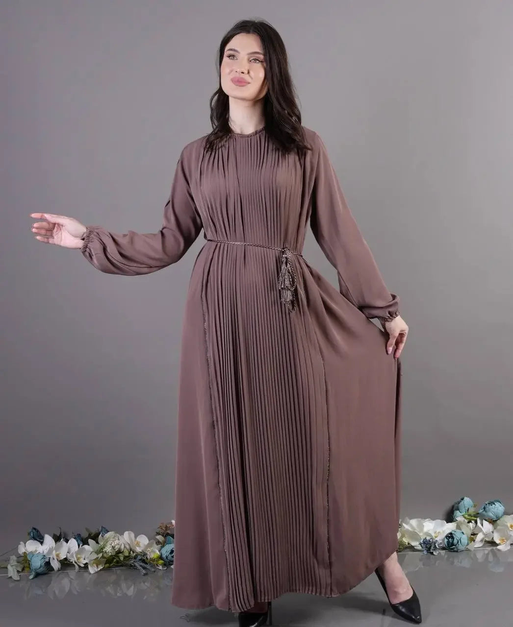 Palestinian Elegance pleated abaya dress in brown with long sleeves and waist tie detail