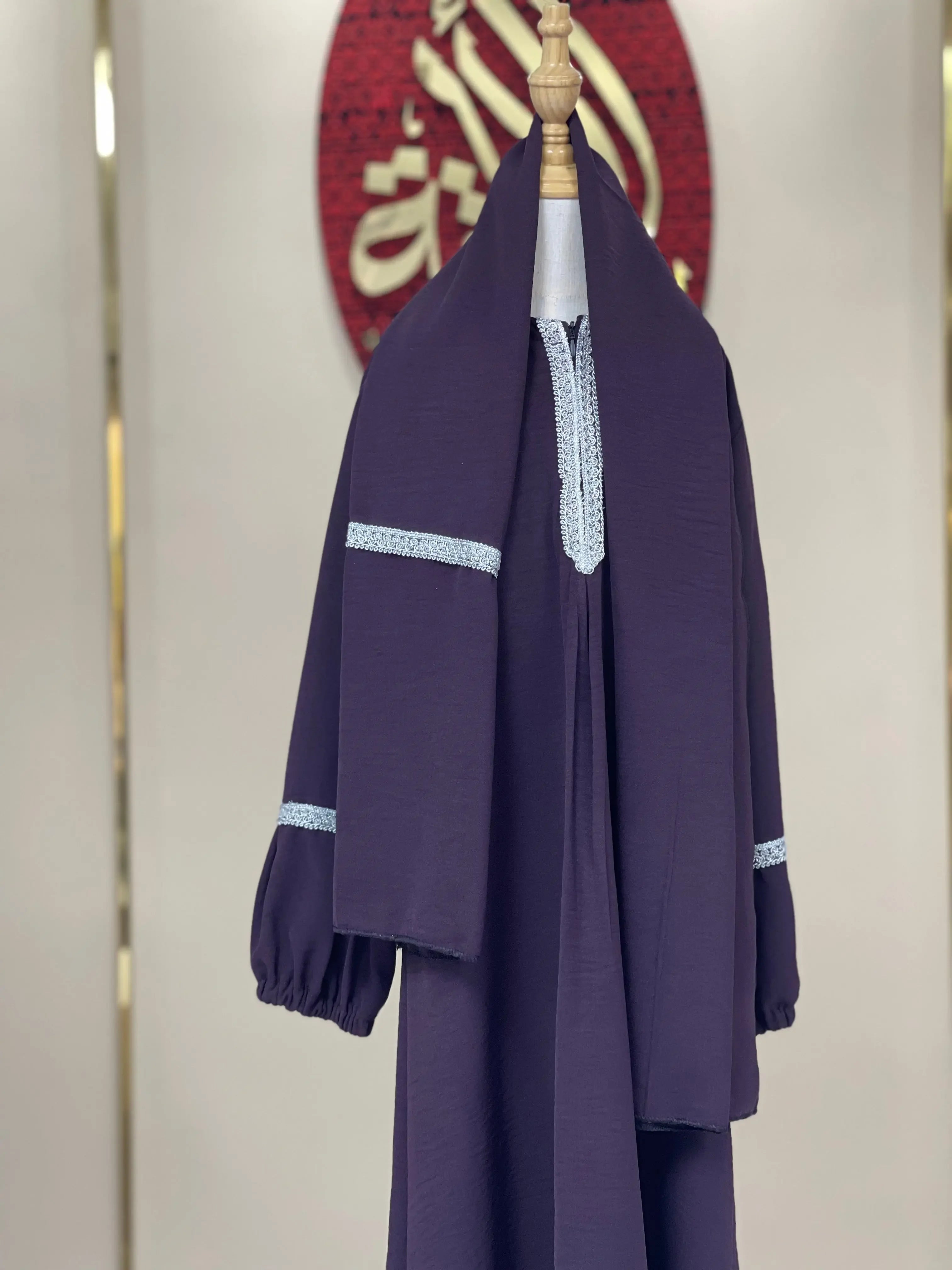 Purple girls embroidered abaya with white lace detailing on sleeves and neckline by Palestinian Elegance