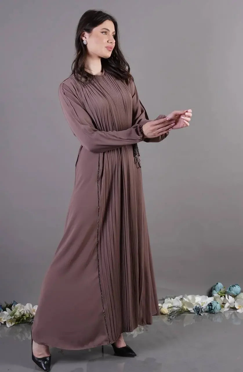 Palestinian Elegance pleated abaya dress in mauve with long sleeves and flowing design