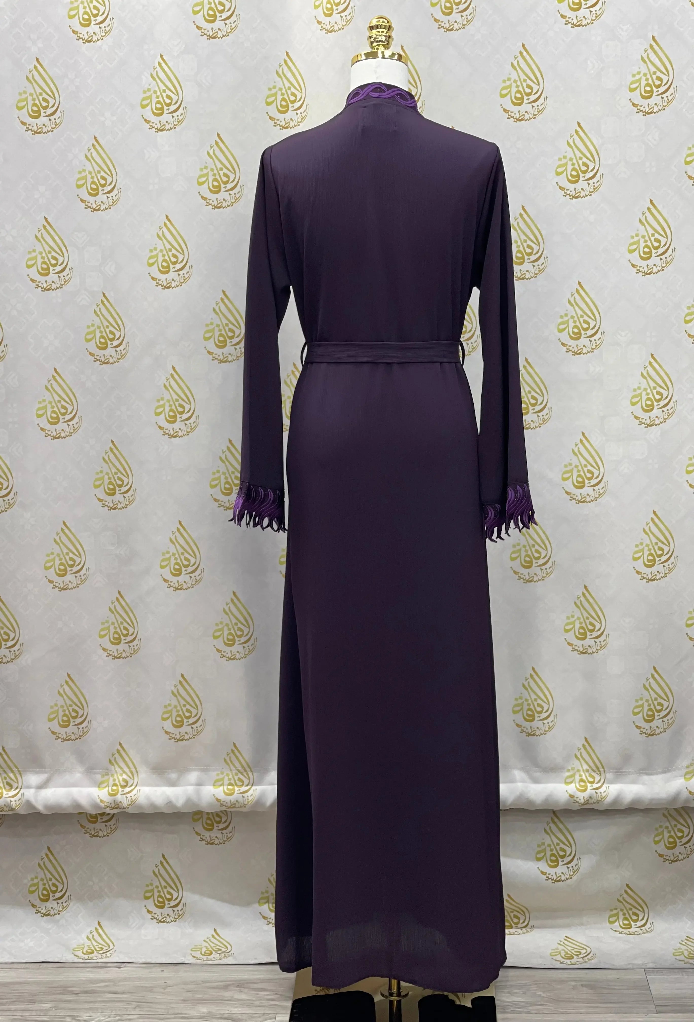 Palestinian Elegance elegant embroidered abaya in deep purple with long sleeves and scalloped cuffs