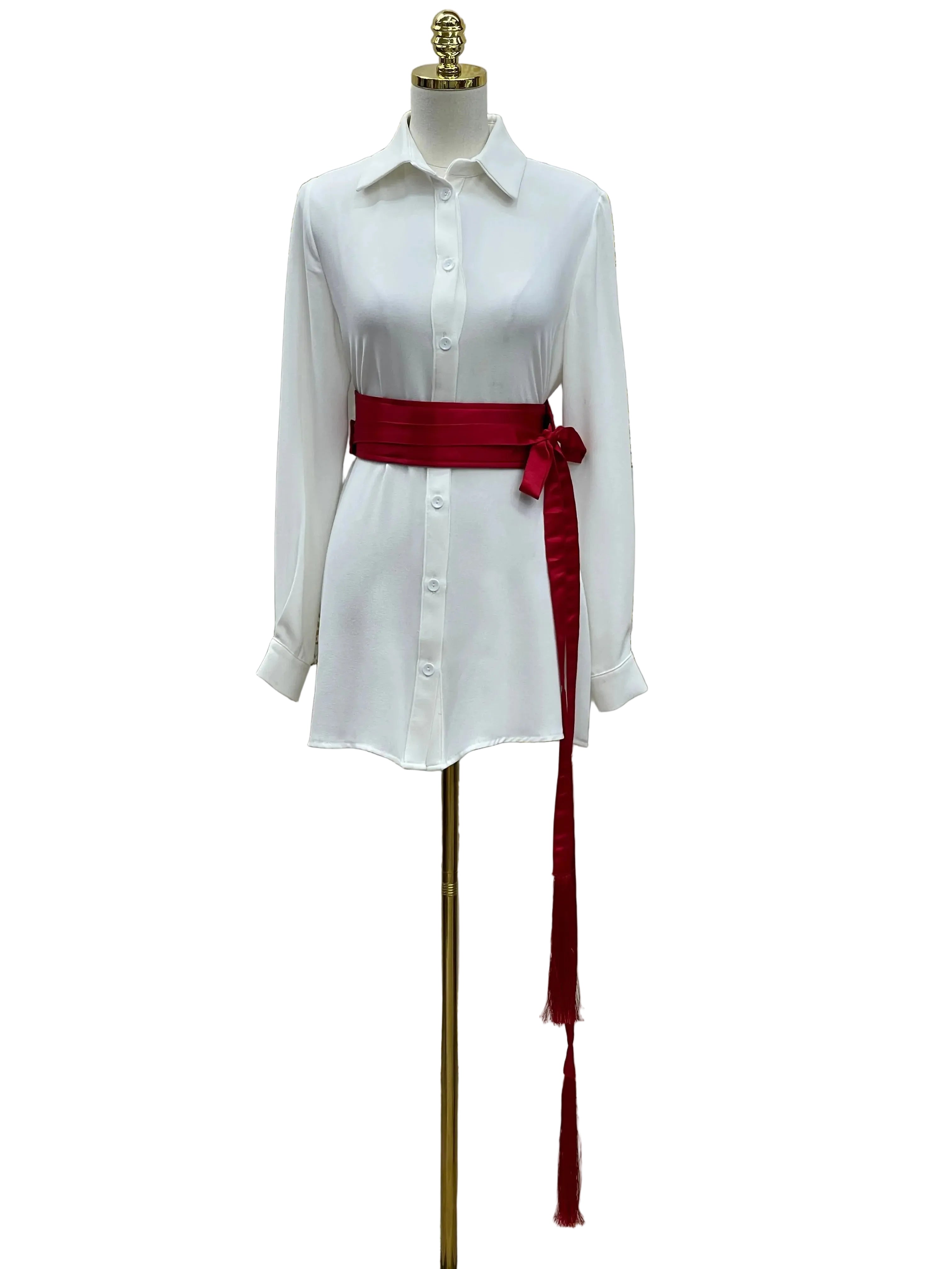 Palestinian Elegance luxury satin belt for dresses in deep red tied around white shirt dress on mannequin