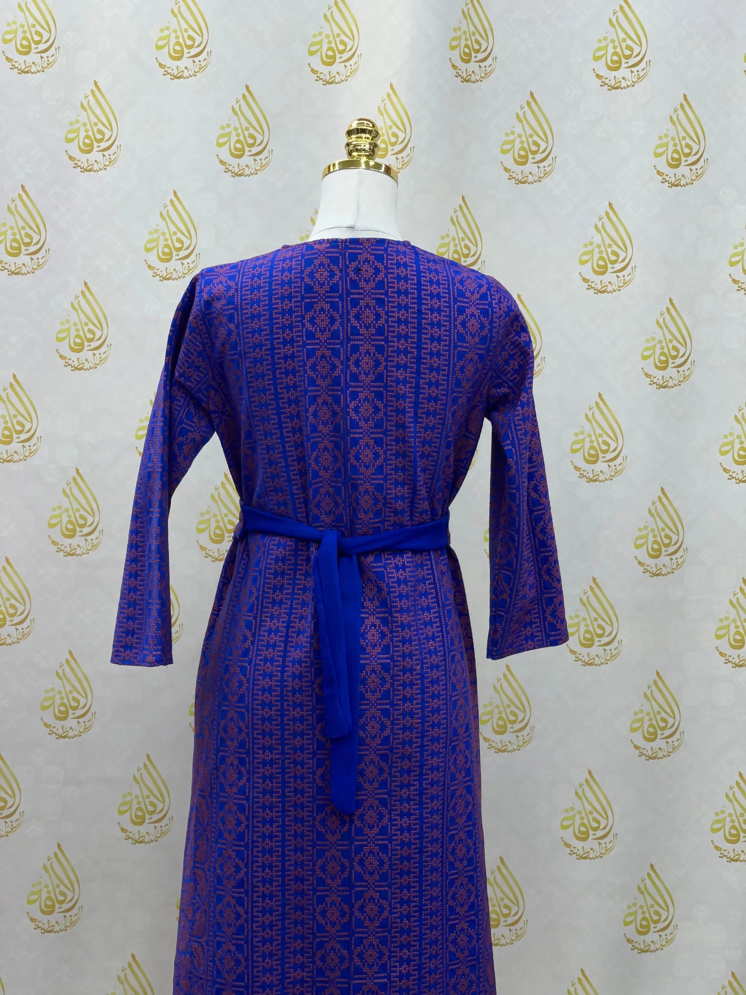 Palestinian Elegance embroidered cardigan for kids in blue with intricate traditional patterns and a waist tie belt