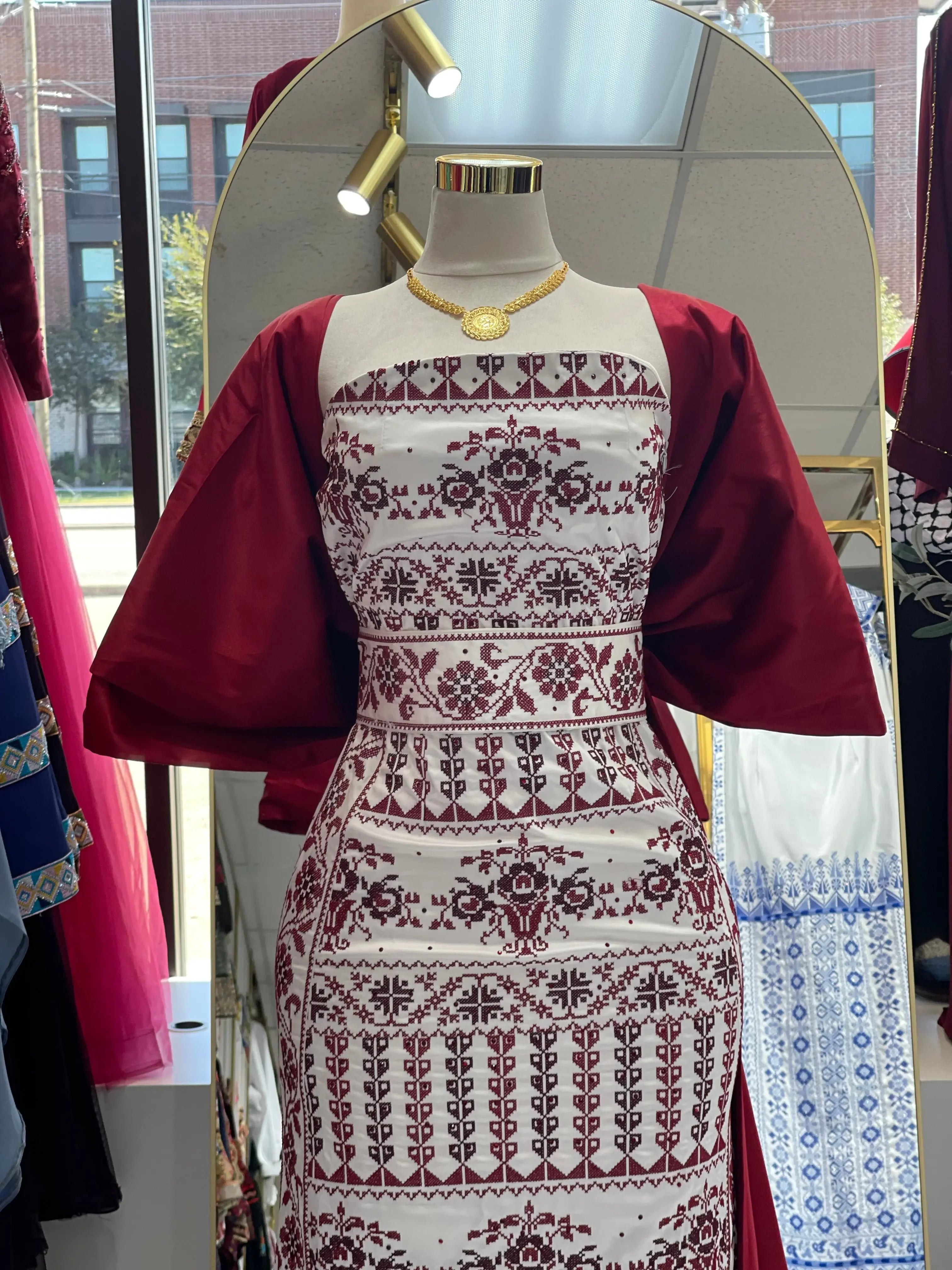 Embroidered Strapless Dress with Oversized Bow: Elegance and Sophistication Palestinian Elegance