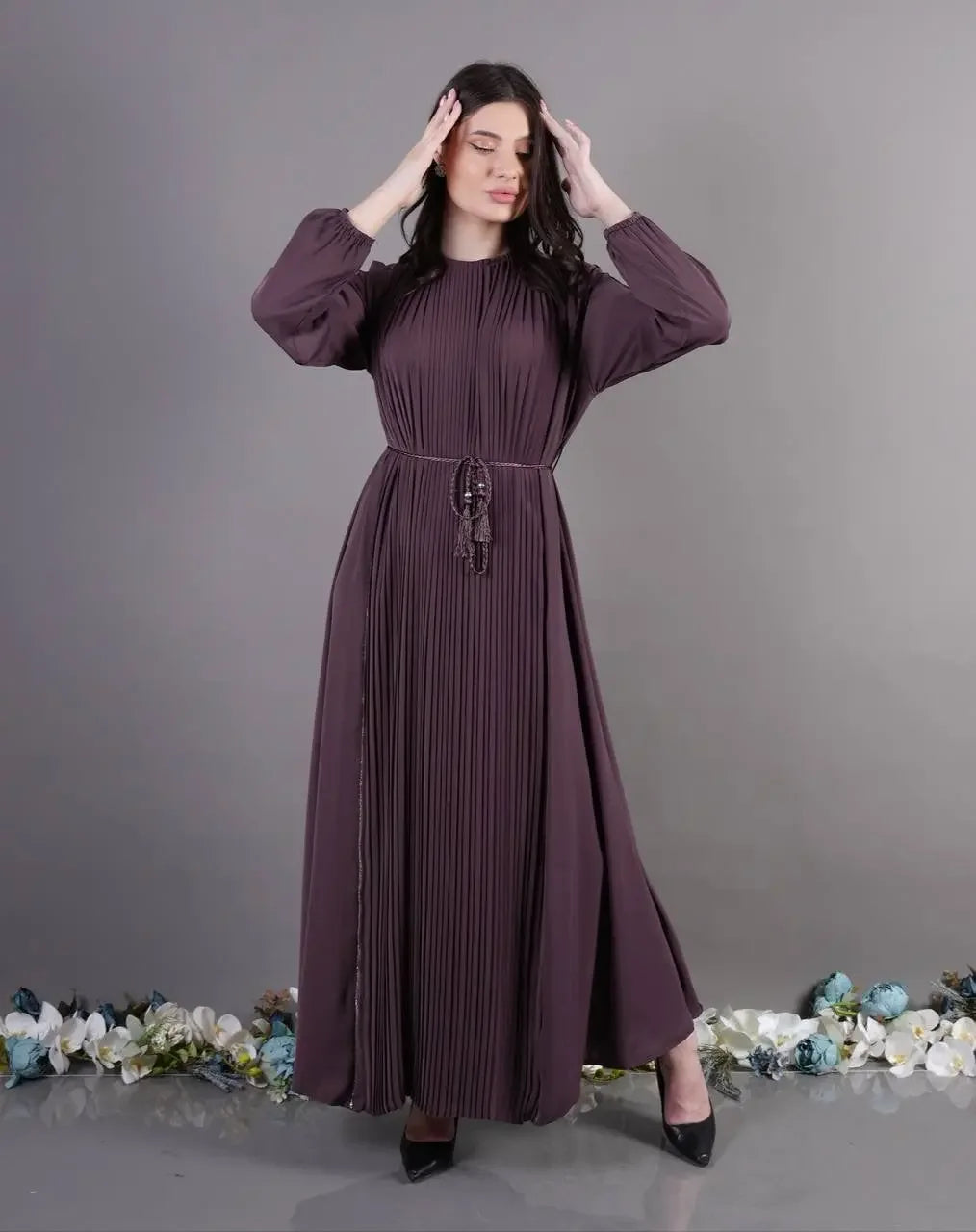 Palestinian Elegance pleated abaya dress in dark purple with long sleeves and a cinched waist belt