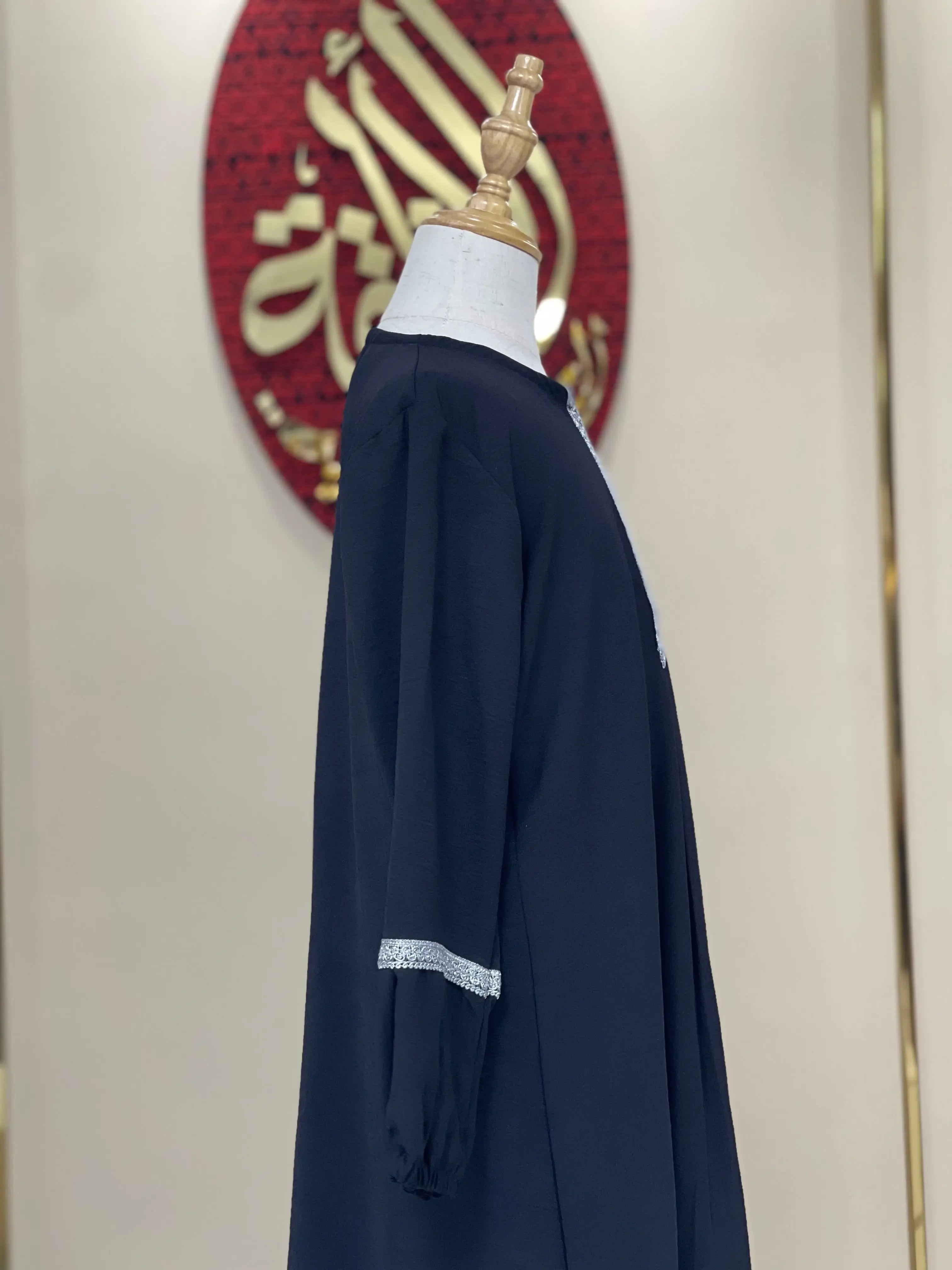 Palestinian Elegance black girls embroidered abaya with silver embroidery detail on sleeve