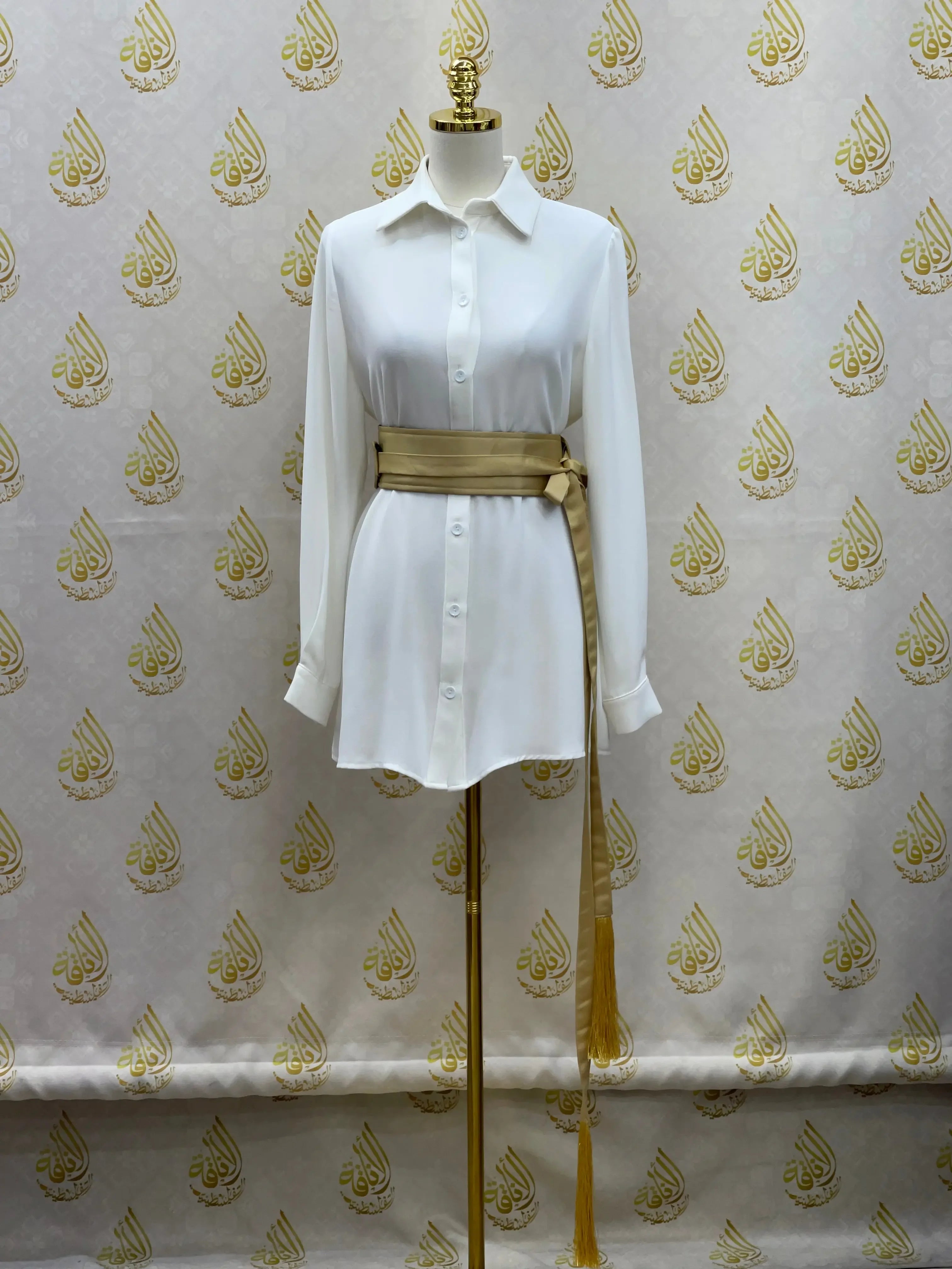 Luxury satin belt for dresses by Palestinian Elegance styled on white button-down dress on mannequin