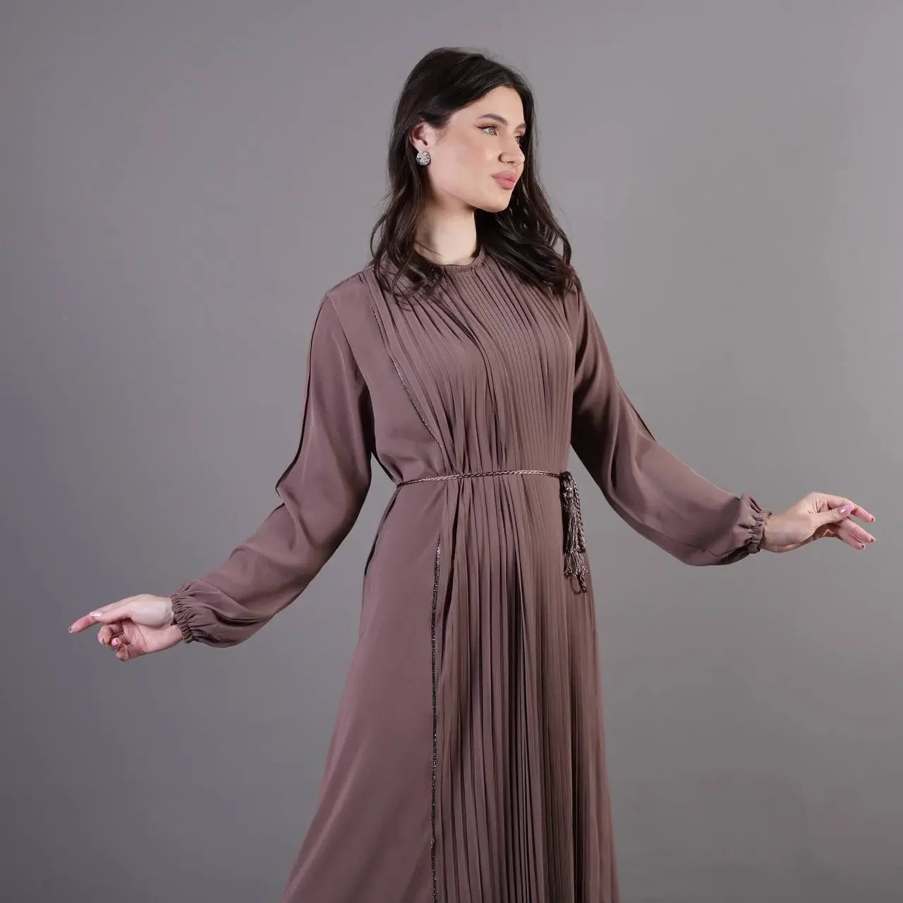 Palestinian Elegance pleated abaya dress in mauve with long sleeves and waist tie belt