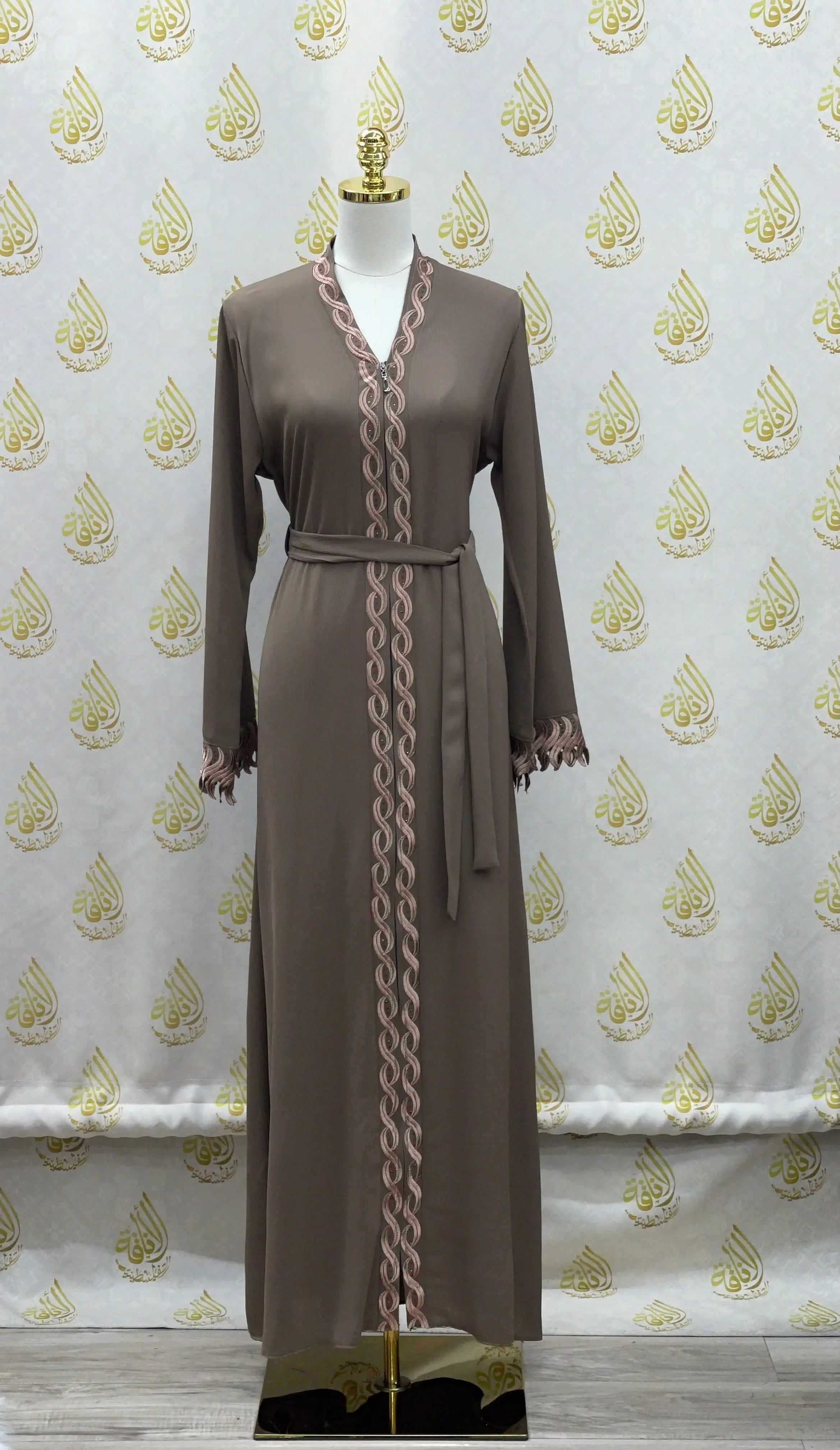 Elegant embroidered abaya in brown with delicate pink embroidery and waist tie by Palestinian Elegance