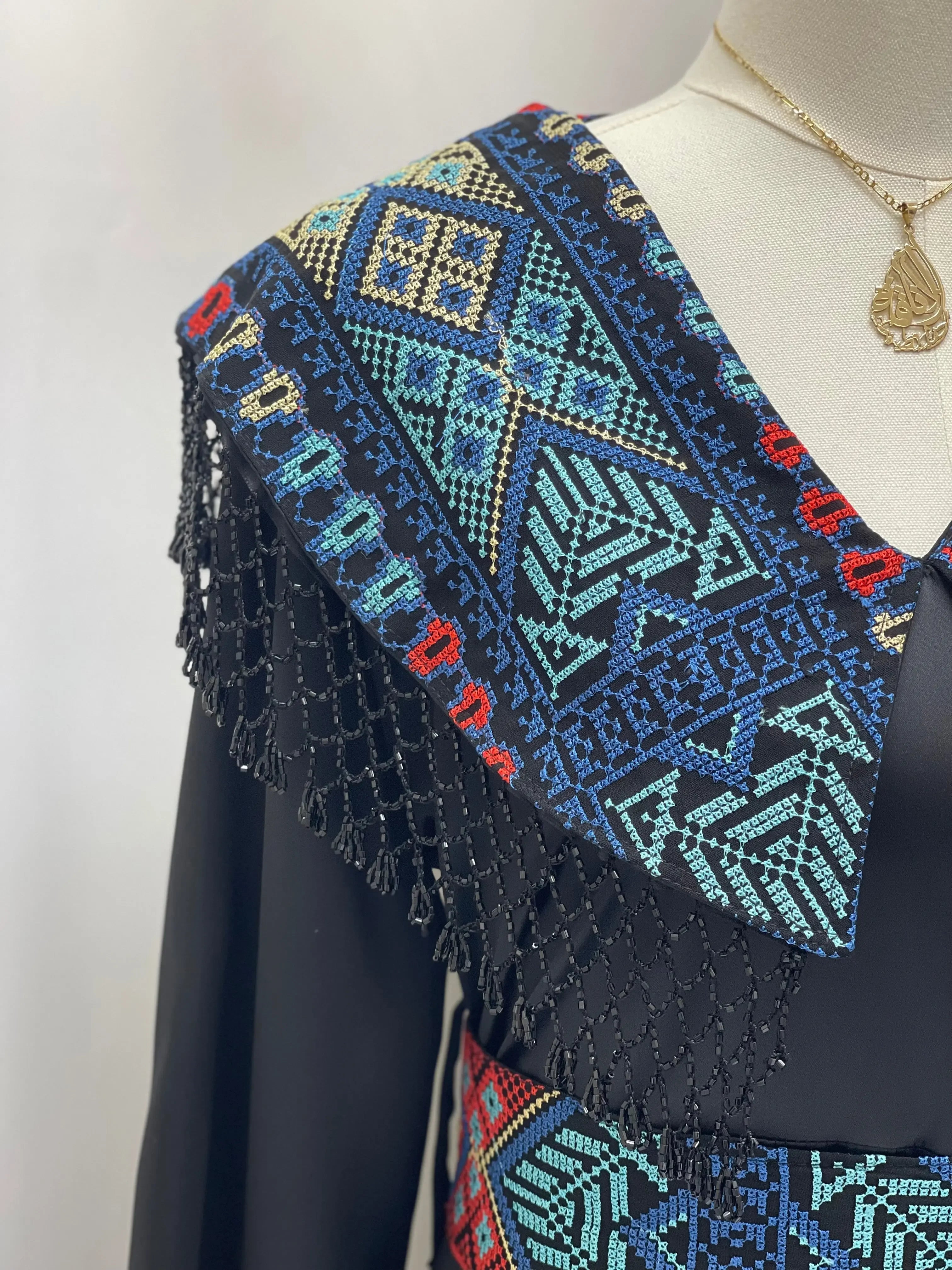 Sophisticated Elegance: Soondos Embroidered Satin Dress Palestinian Elegance