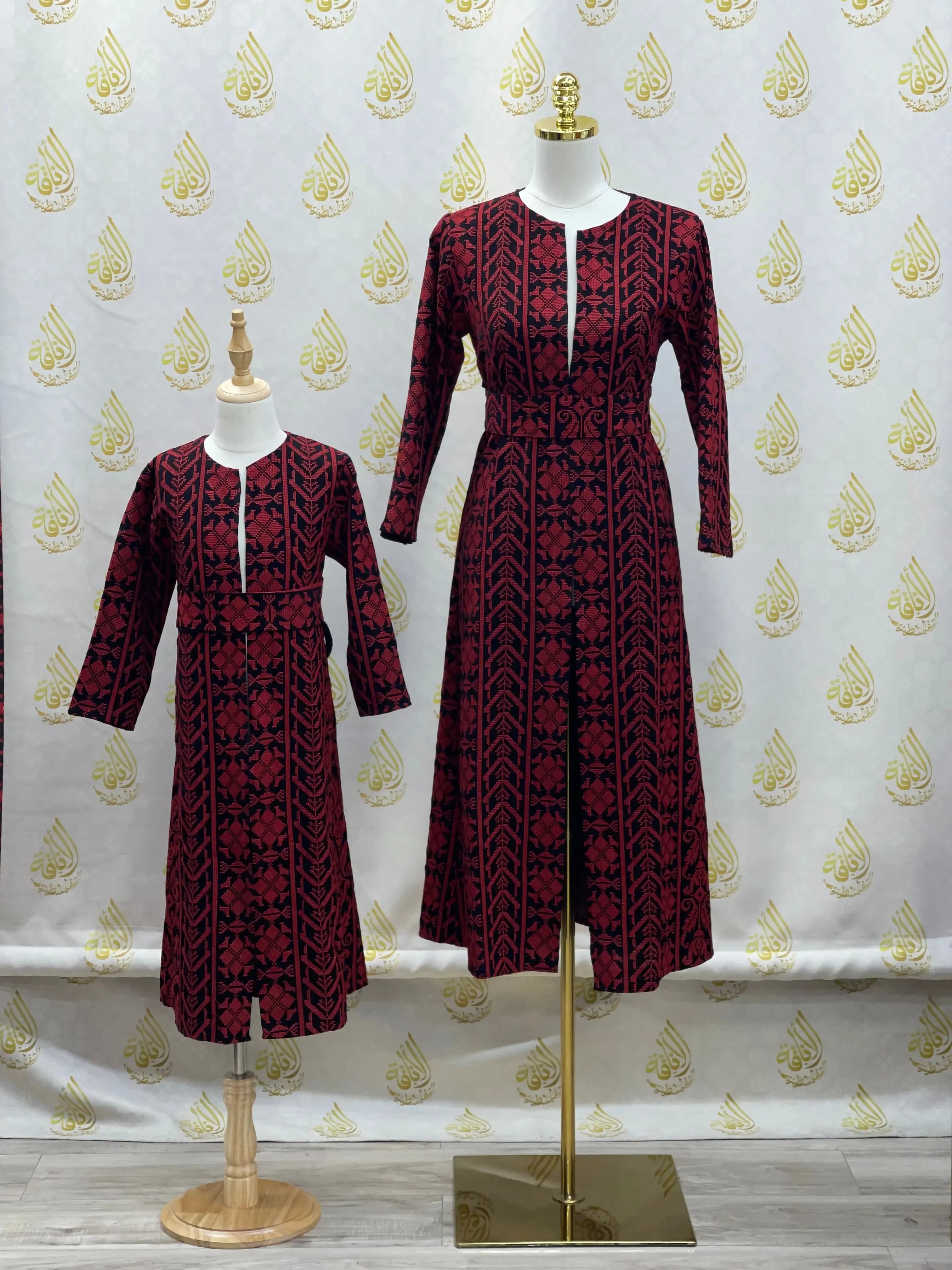 Palestinian Elegance embroidered cardigan for kids with red and black traditional patterns displayed on mannequin