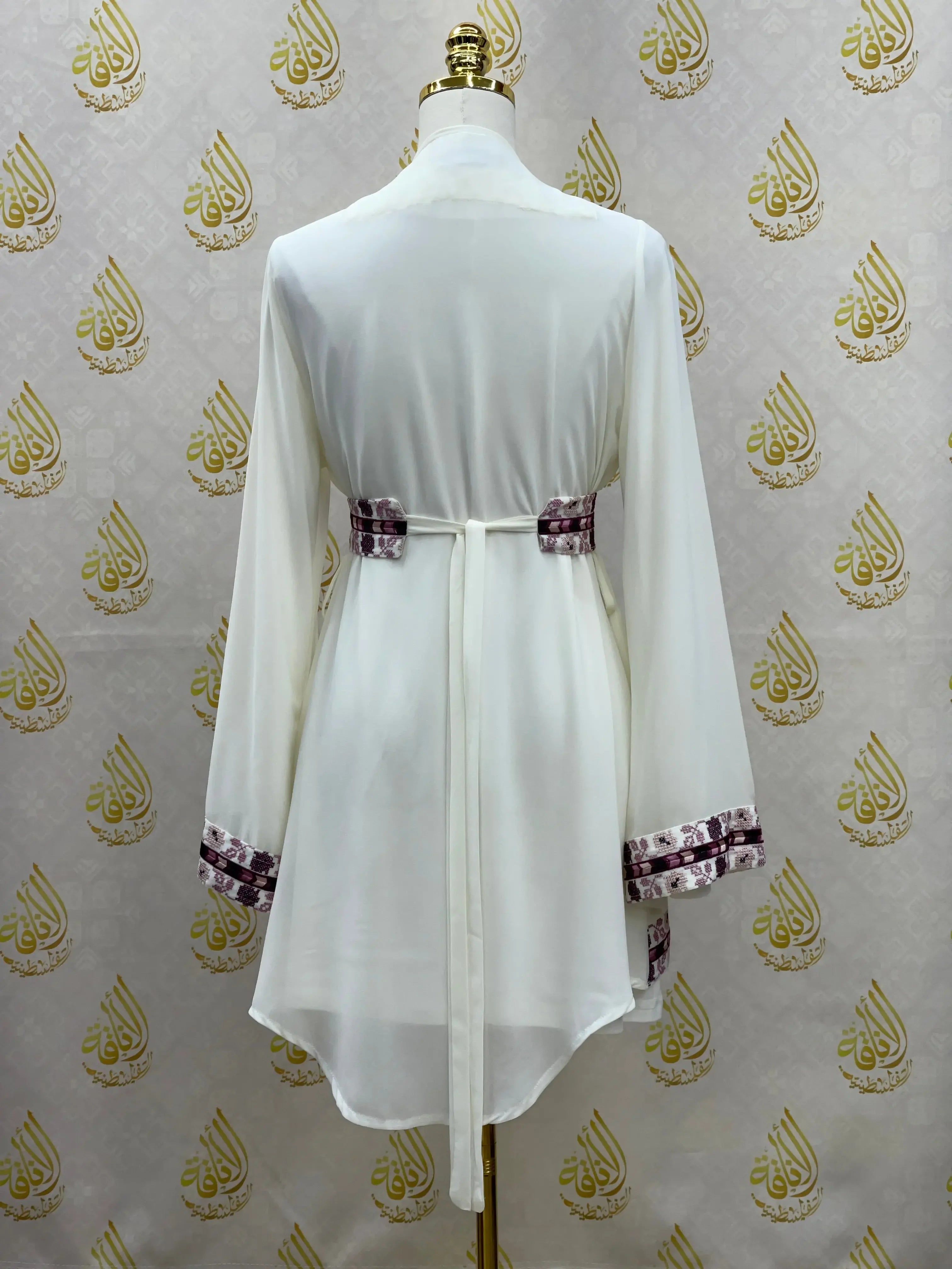 Back view of embroidered chiffon kimono cardigan by Palestinian Elegance with long sleeves and detailed cuffs