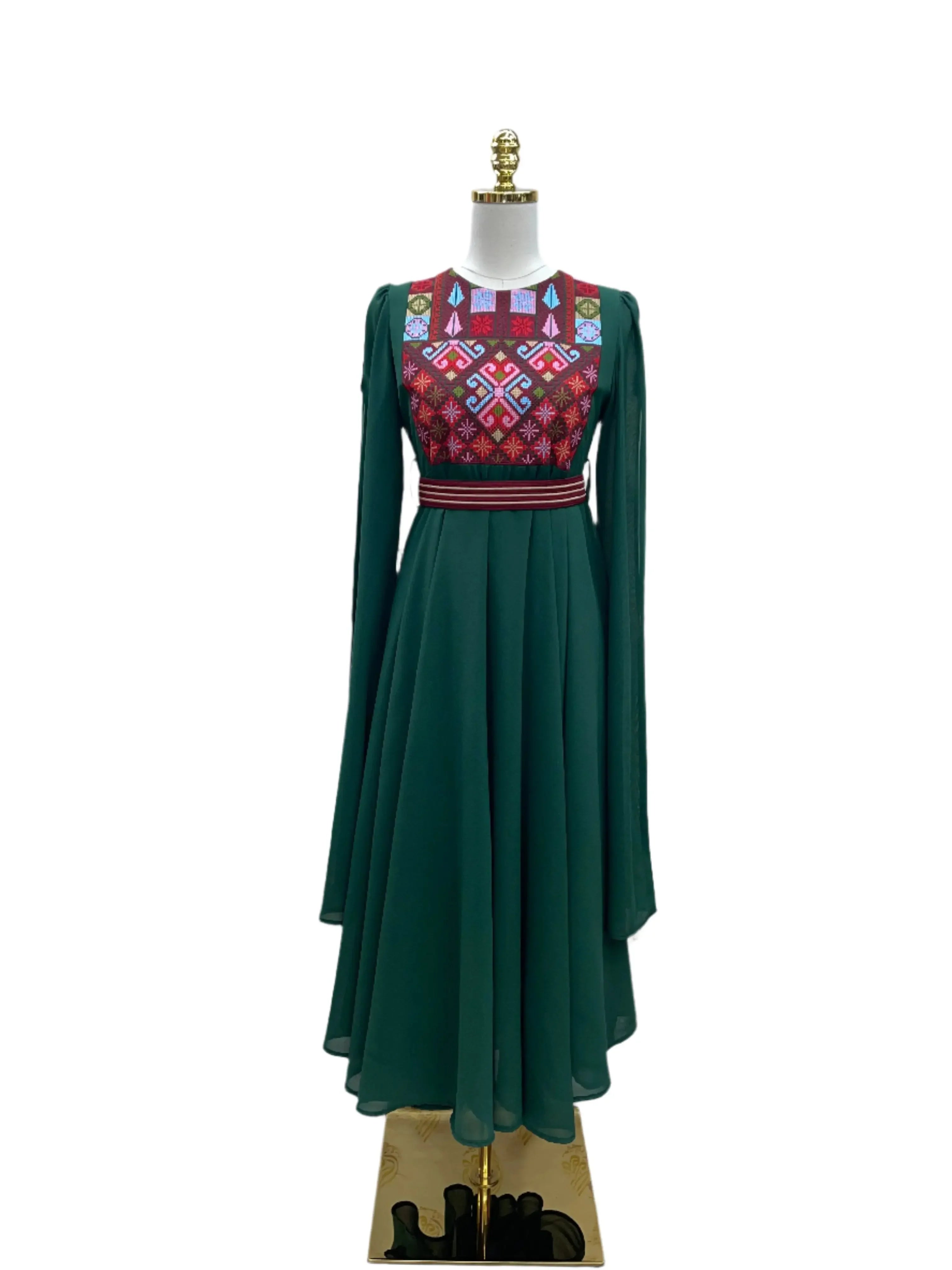 Palestinian girls embroidered dress in dark green with colorful traditional embroidery on the bodice and long sleeves