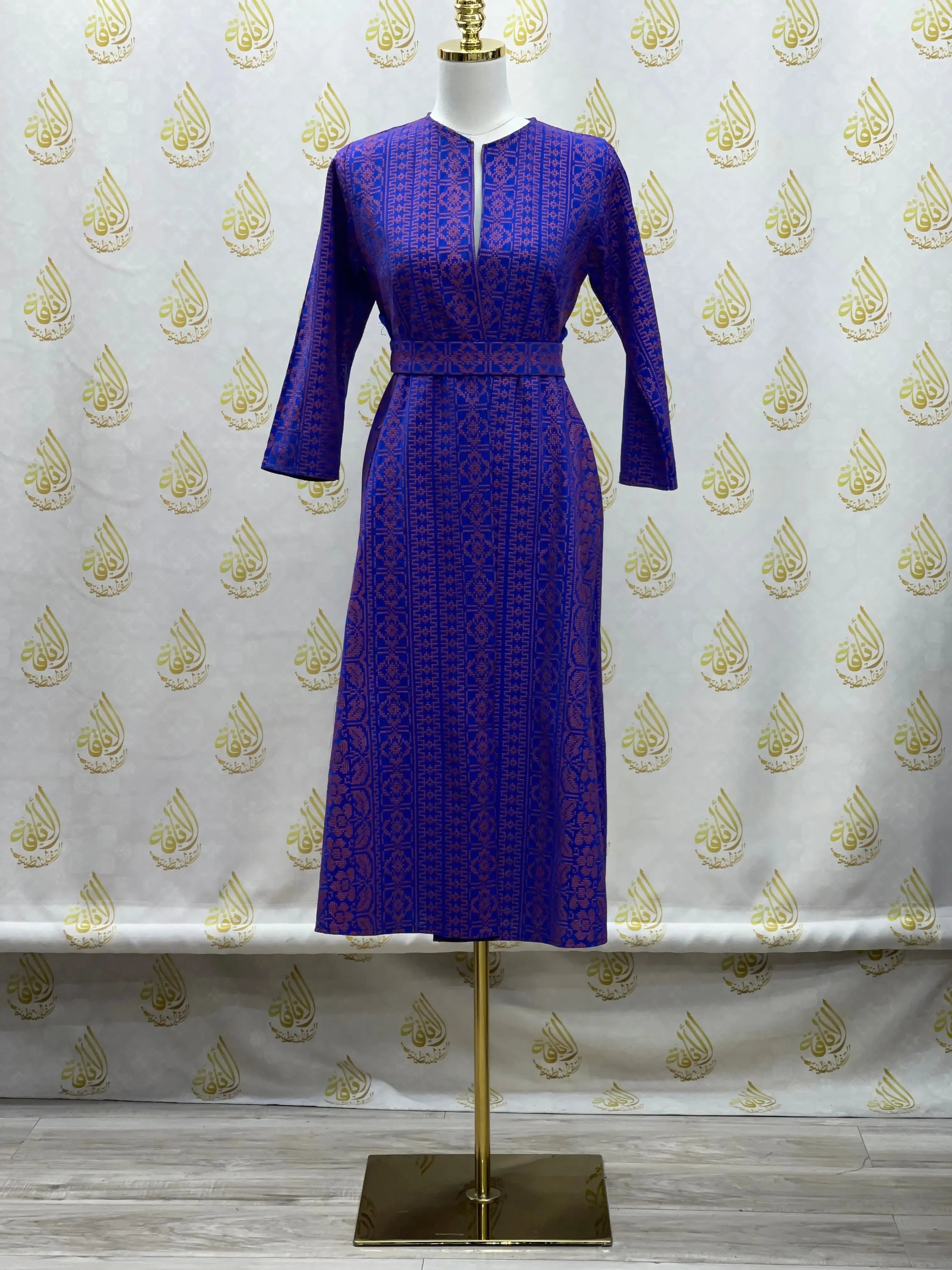 Palestinian Elegance embroidered cardigan for kids in blue with traditional patterns on a mannequin