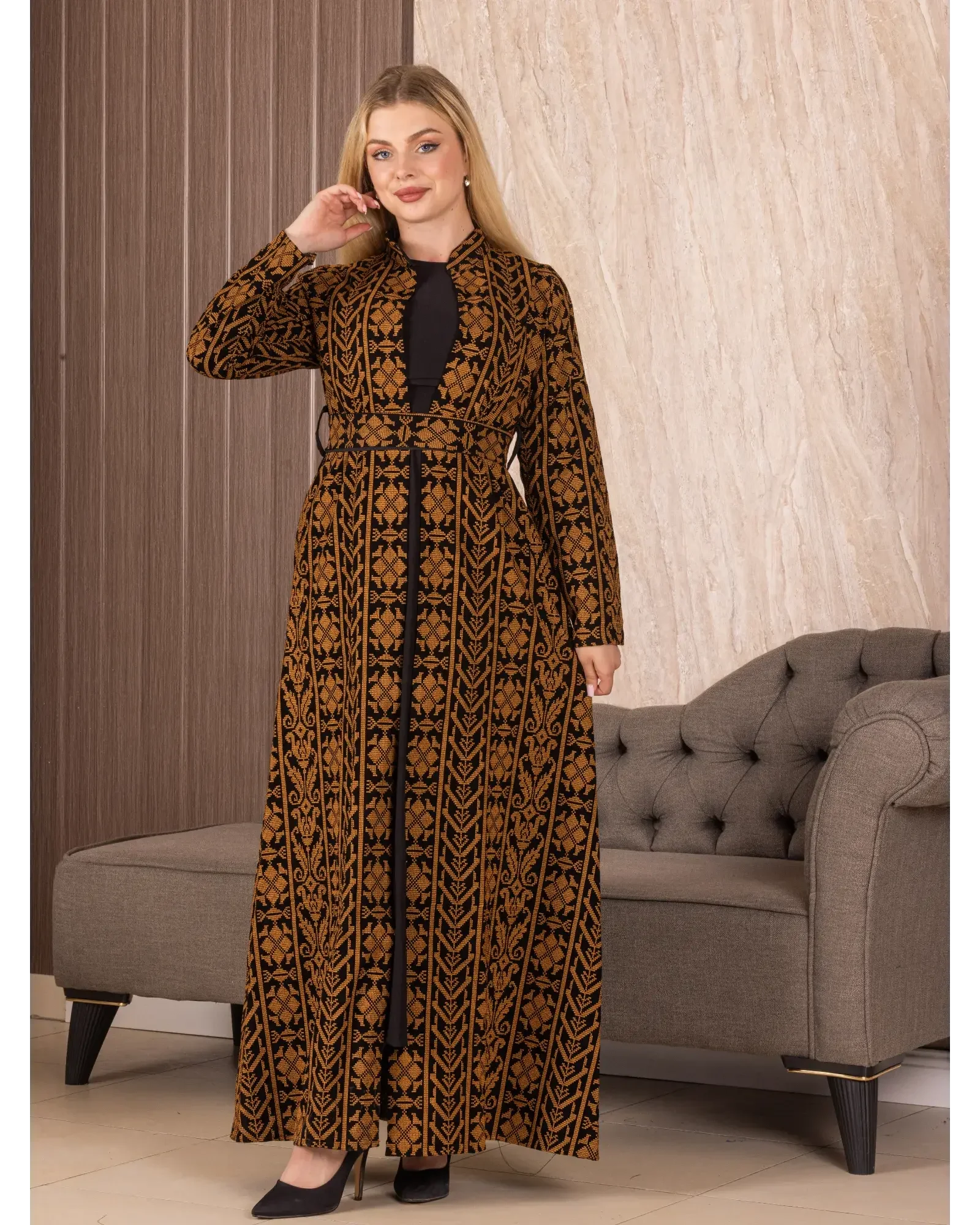 Palestinian Elegance embroidered long cardigan in brown and black with traditional patterns worn by model