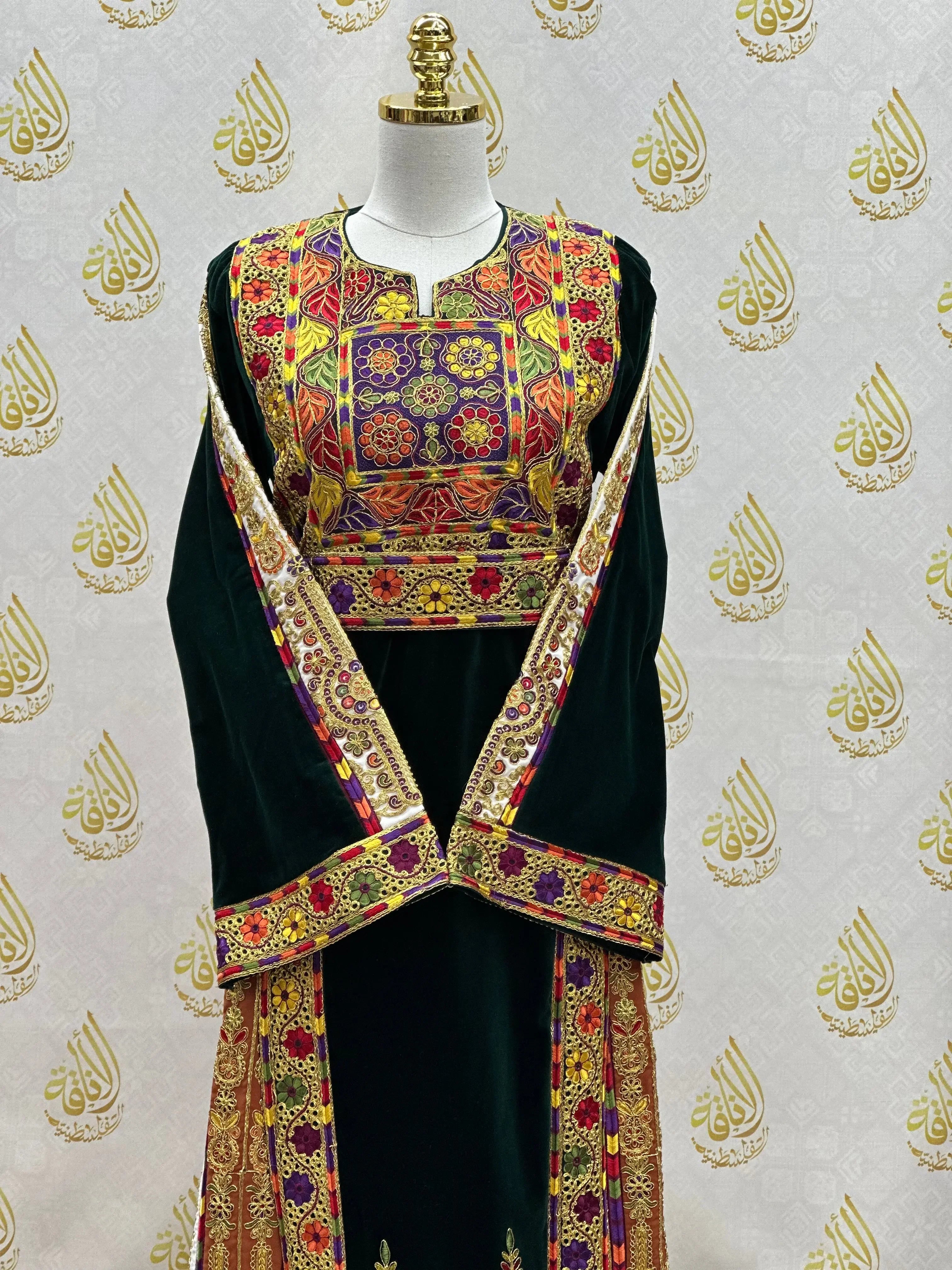 Velvet Palestinian dress with intricate colorful embroidery from Palestinian Elegance