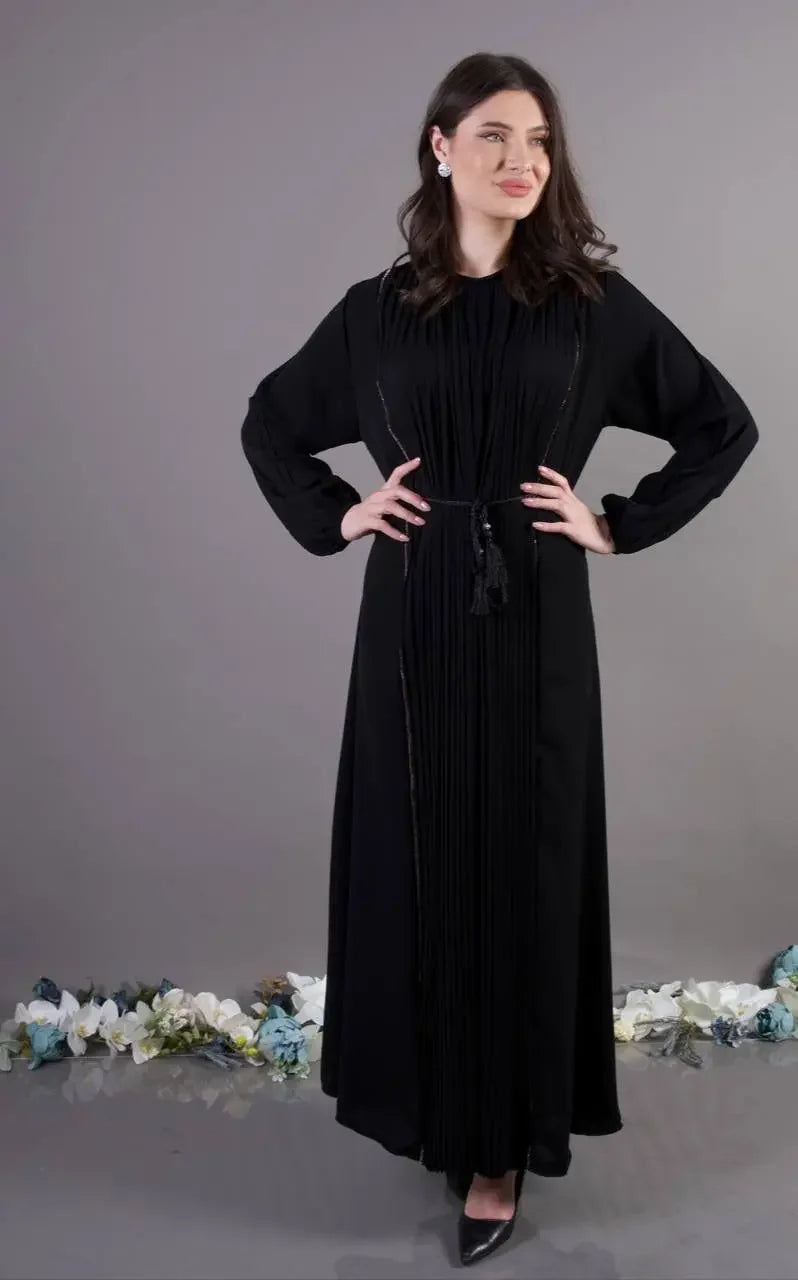 Palestinian Elegance black pleated abaya dress with long sleeves and tassel belt