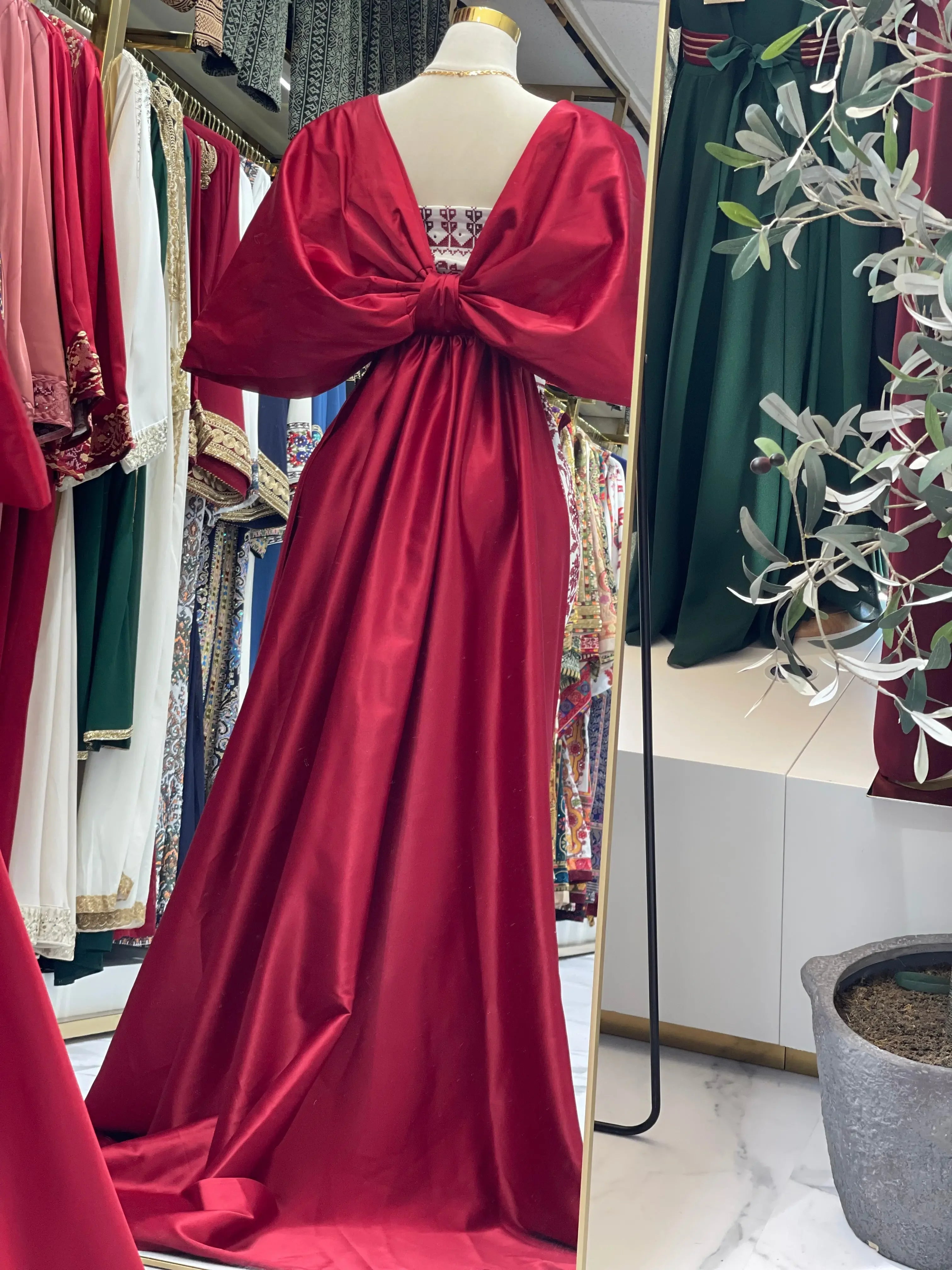 Embroidered Strapless Dress with Oversized Bow: Elegance and Sophistication Palestinian Elegance