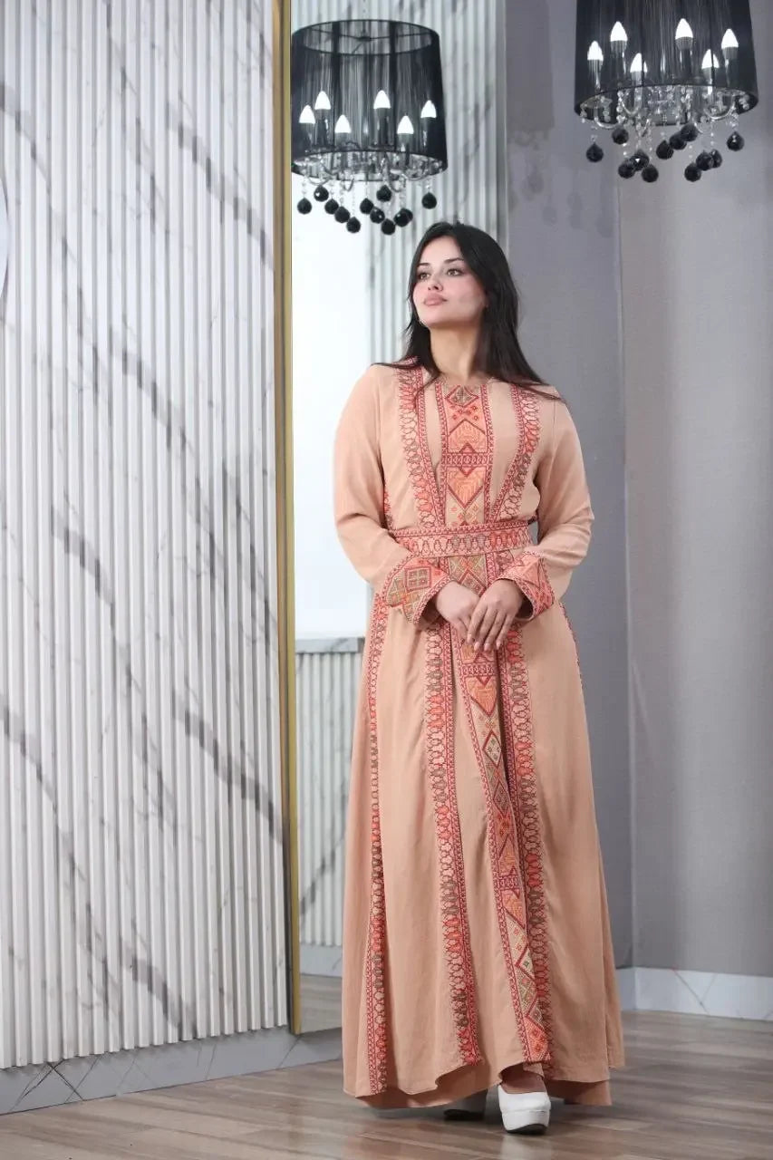 Palestinian Elegance embroidered abaya for women in peach with intricate red embroidery design