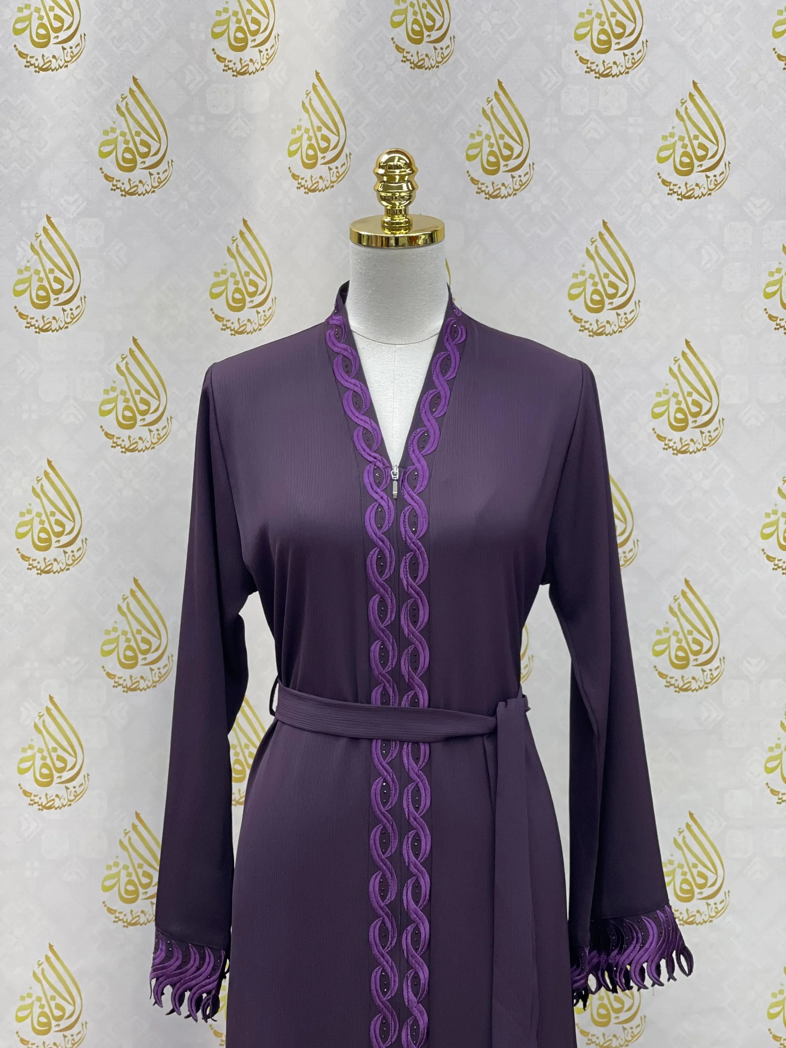 Elegant embroidered abaya in deep purple with intricate trim and belt by Palestinian Elegance