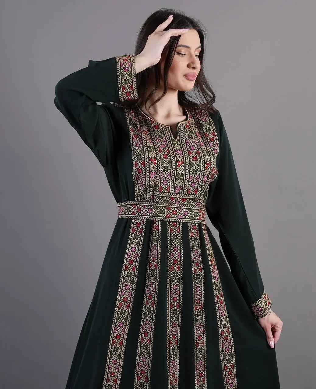 Palestinian Elegance embroidered abaya dress in dark green with intricate floral embroidery on front and cuffs