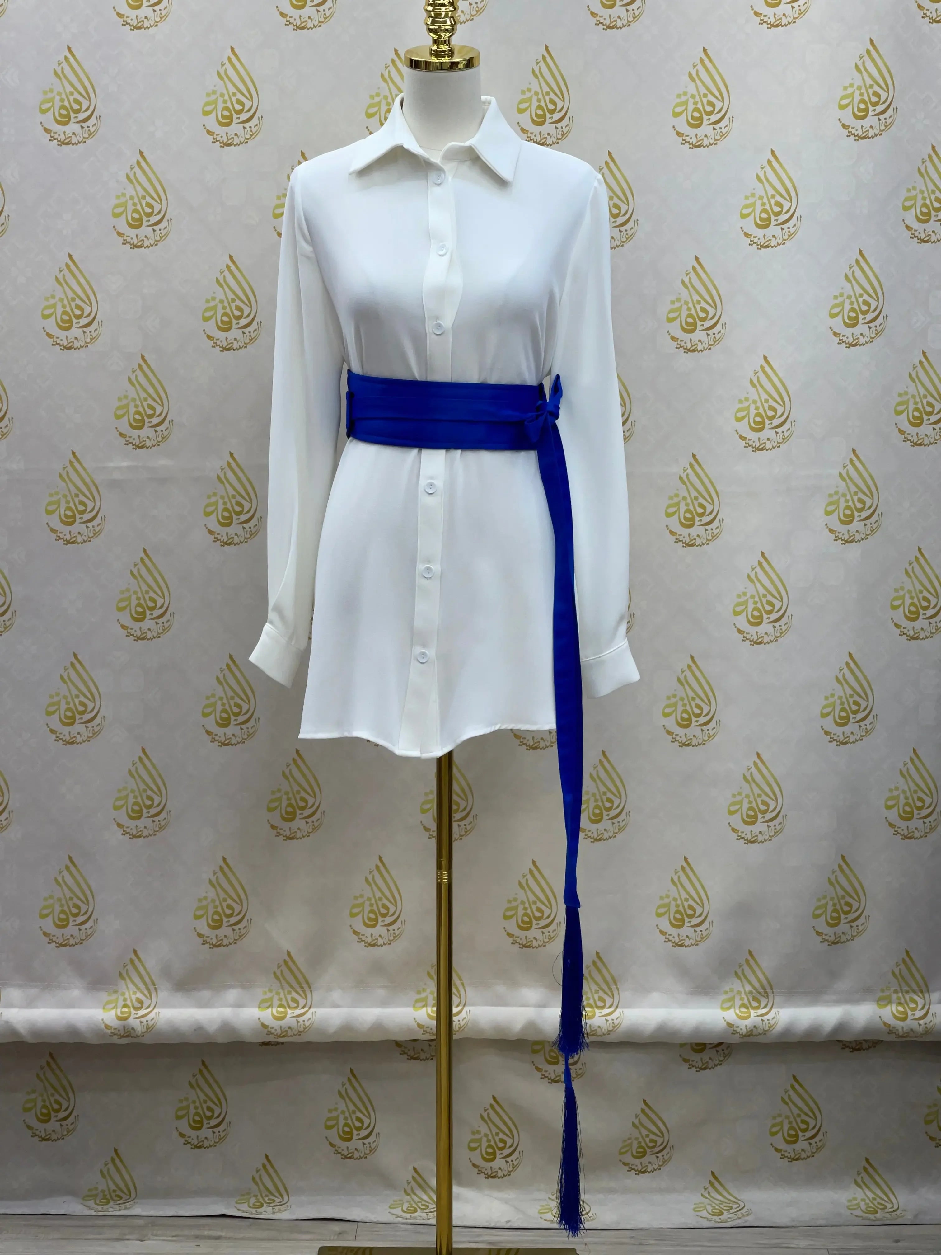 Luxury satin belt for dresses in royal blue styled on a white button-down dress by Palestinian Elegance