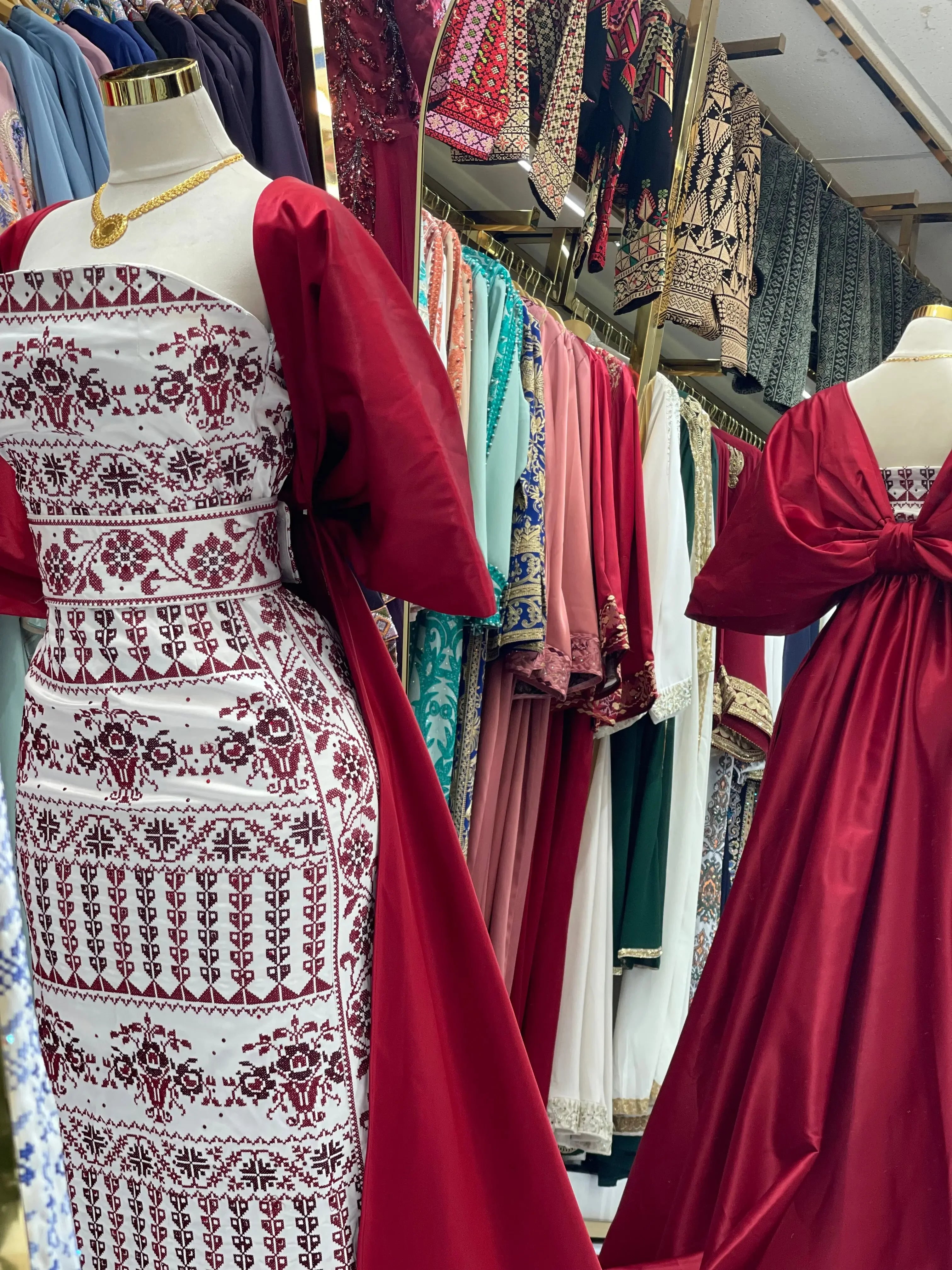 Embroidered Strapless Dress with Oversized Bow: Elegance and Sophistication Palestinian Elegance