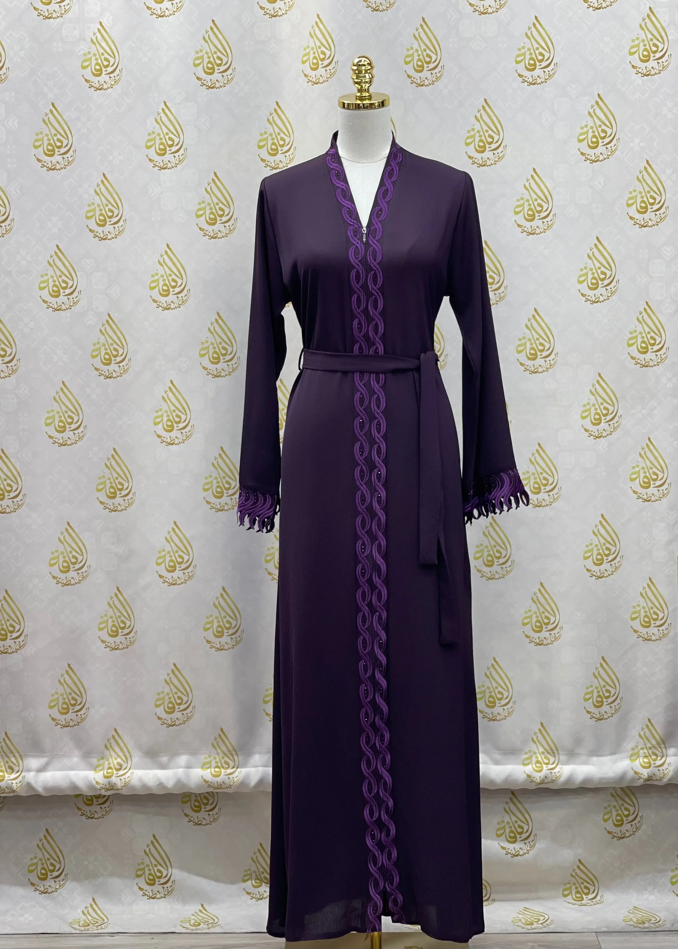 Palestinian Elegance elegant embroidered abaya in deep purple with detailed embroidery along front and cuffs