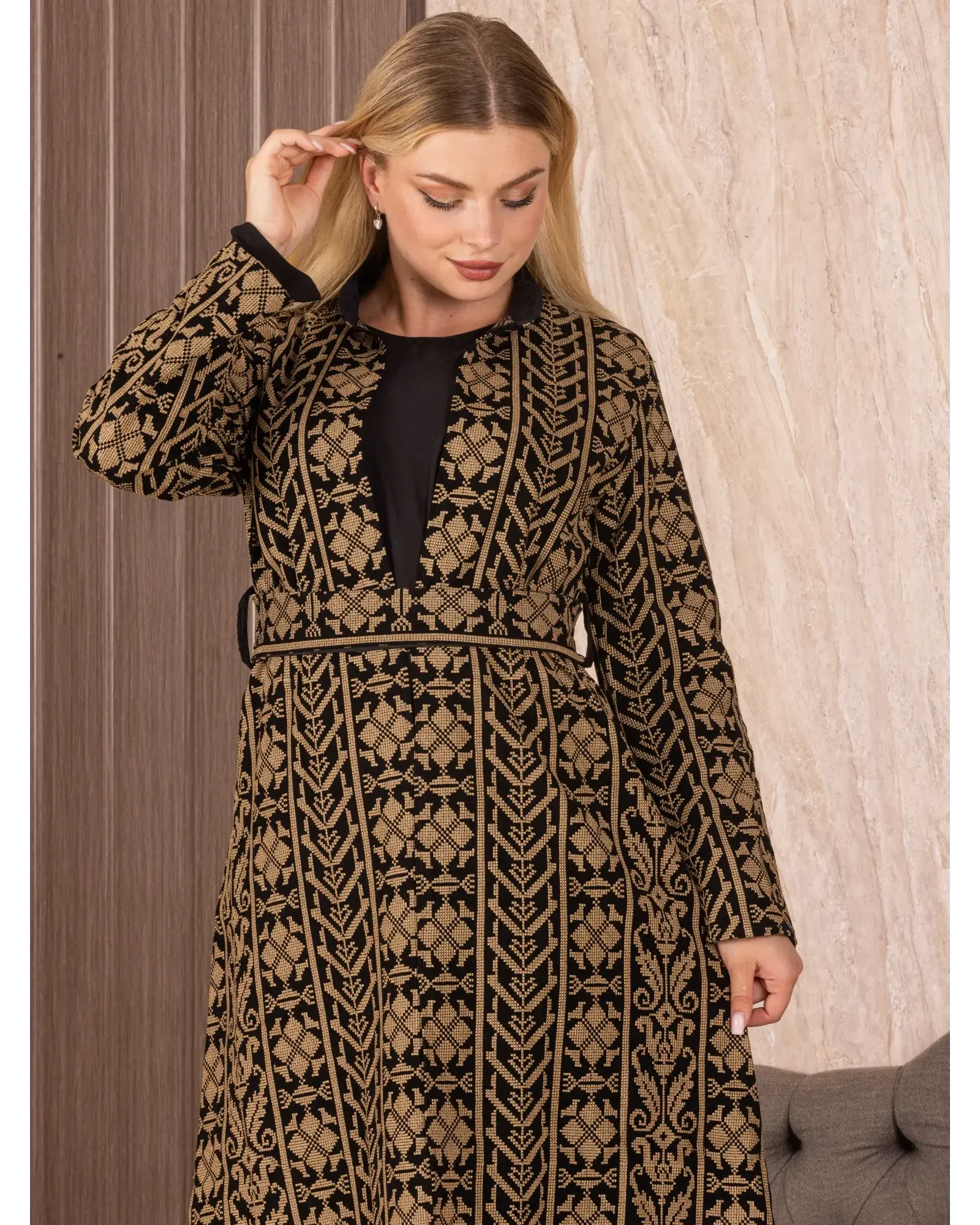 Palestinian Elegance embroidered long cardigan with intricate black and gold geometric patterns