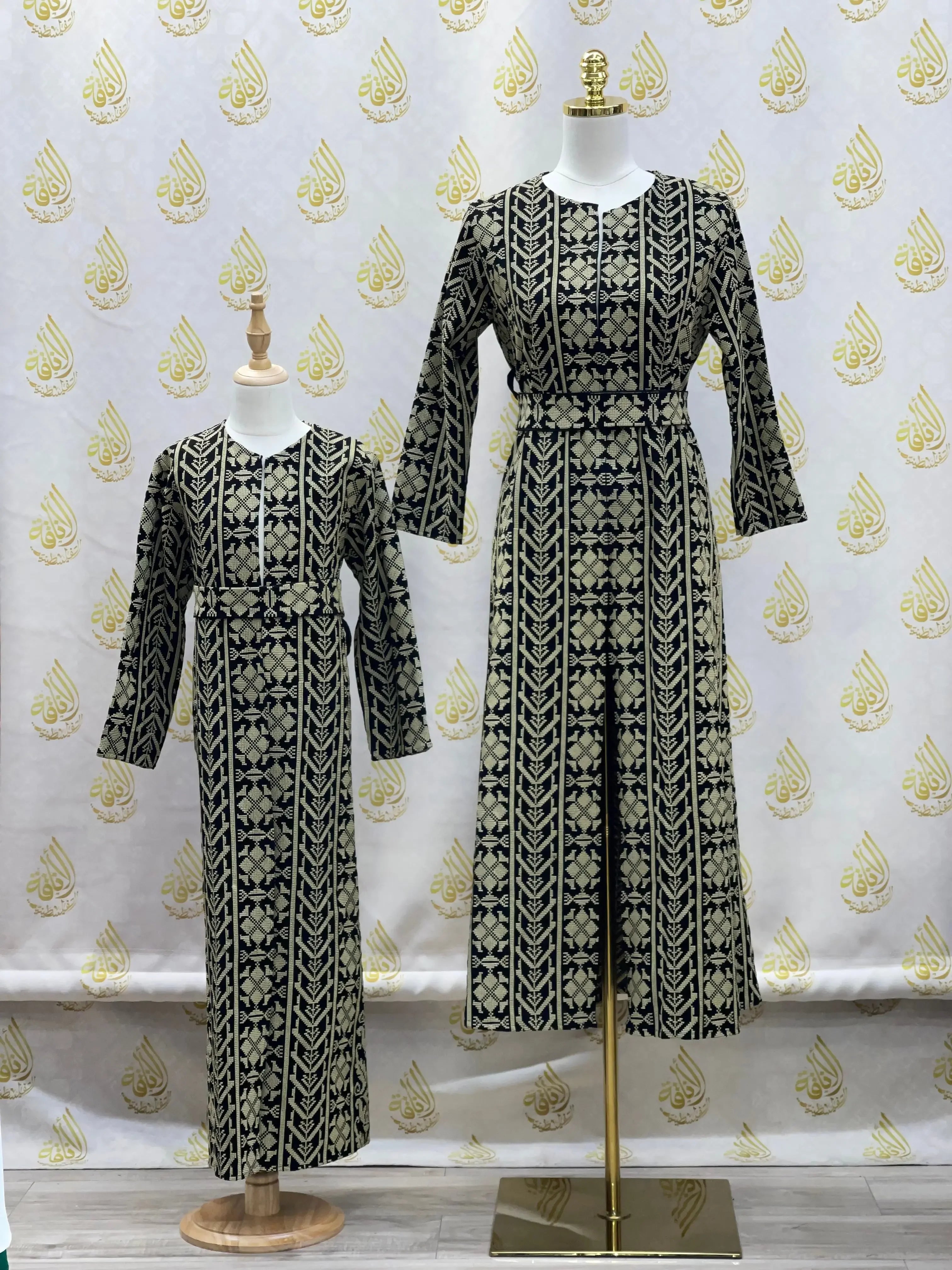 Palestinian Elegance embroidered cardigan for kids with intricate black and gold embroidery on long sleeves and full length