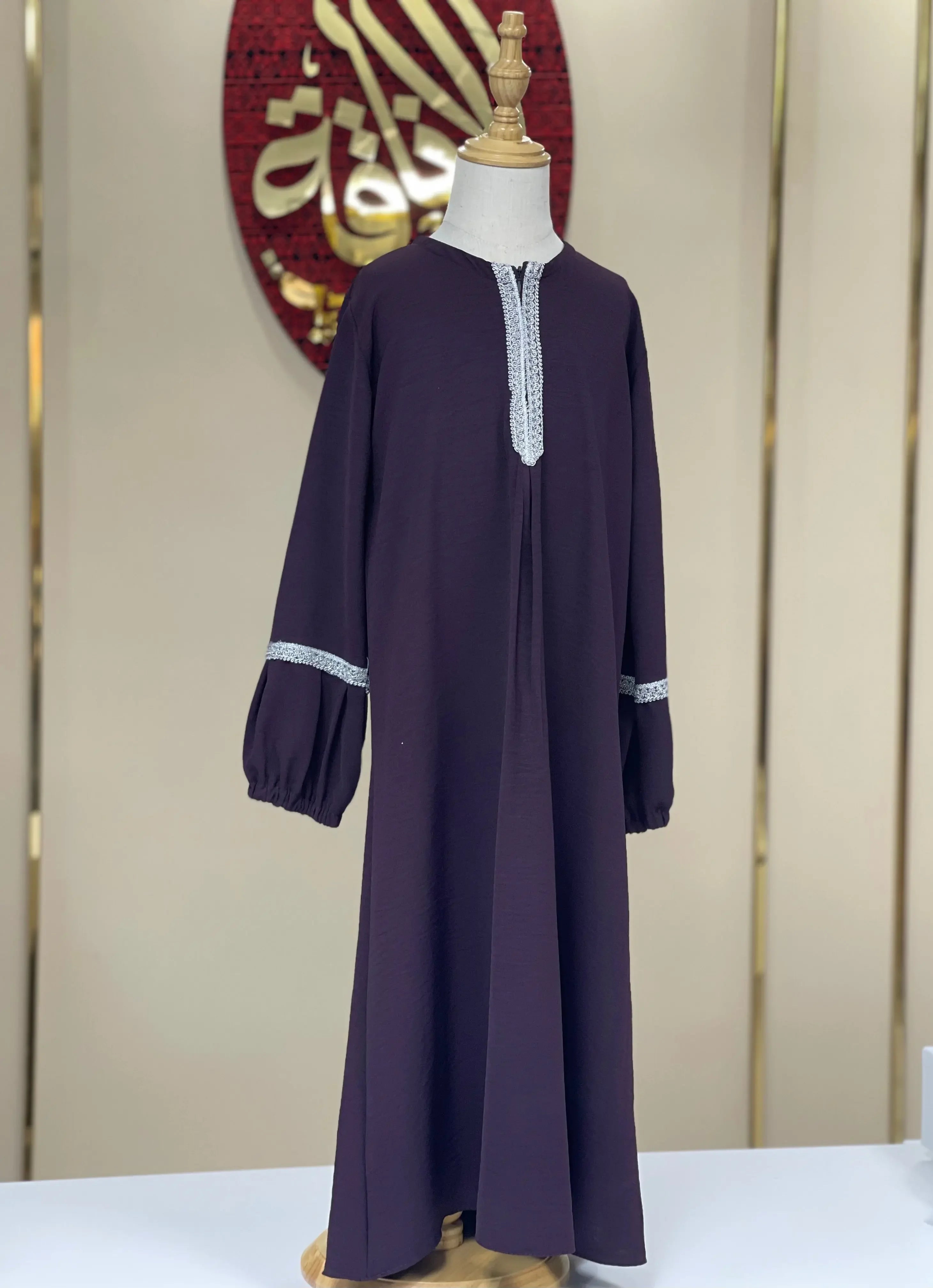 Palestinian Elegance girls embroidered abaya in deep purple with white embroidery on neckline and sleeves