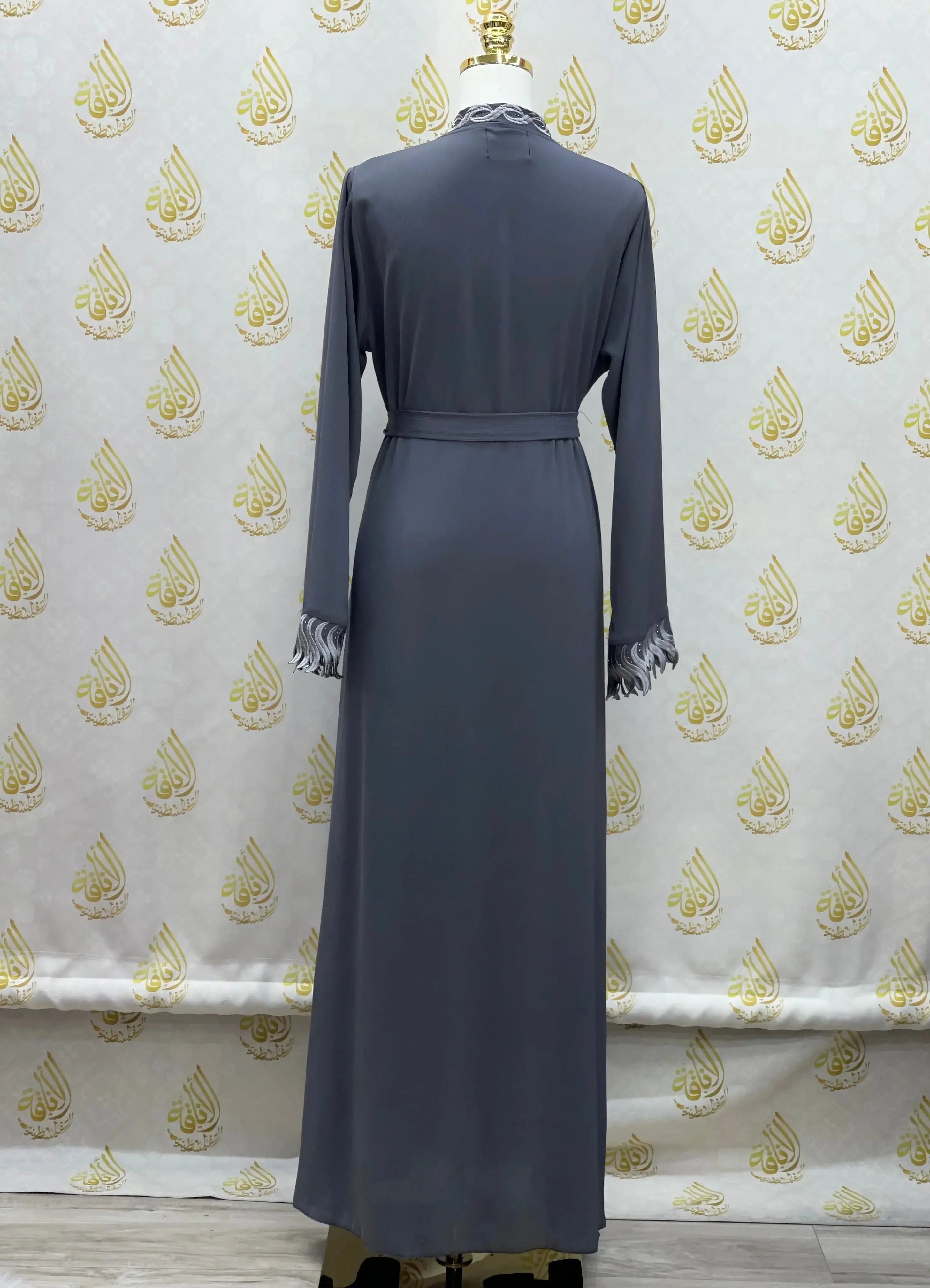 Back view of elegant embroidered abaya in dark gray with long sleeves and belt from Palestinian Elegance