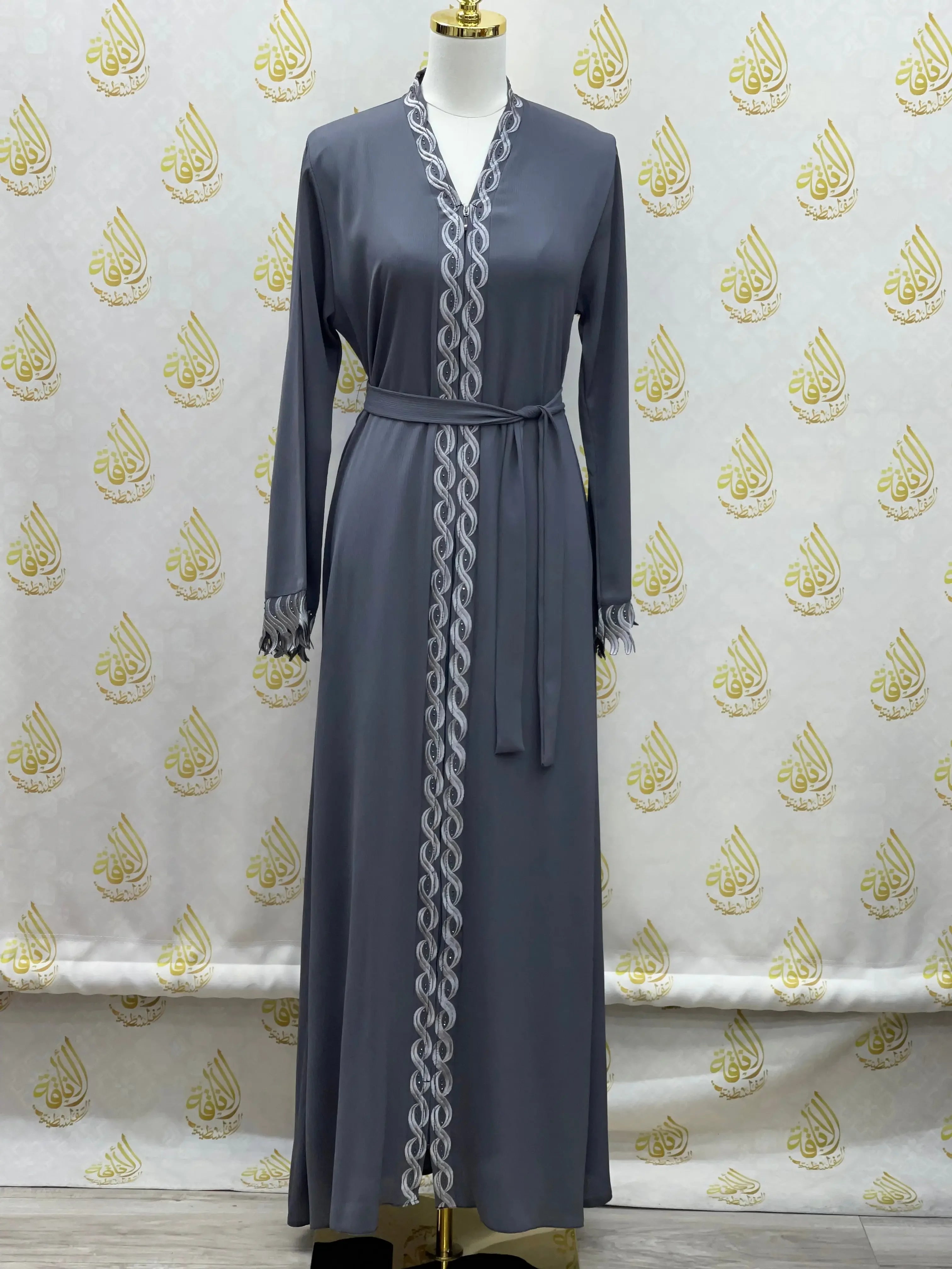 Elegant embroidered abaya in gray with intricate silver embroidery and a matching belt by Palestinian Elegance