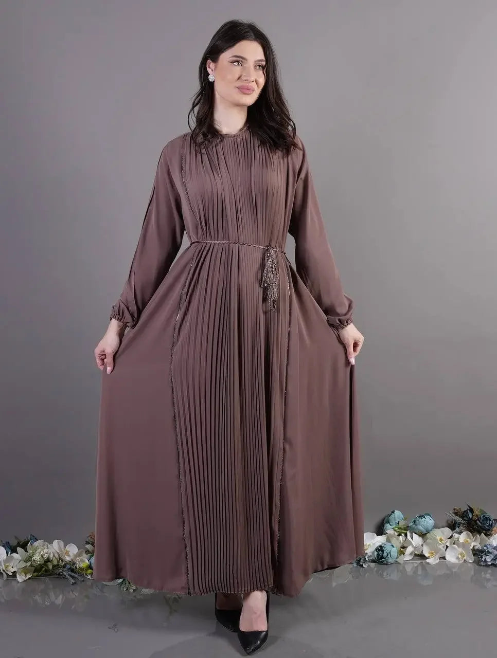 Palestinian Elegance pleated abaya dress in brown with long sleeves and waist detailing