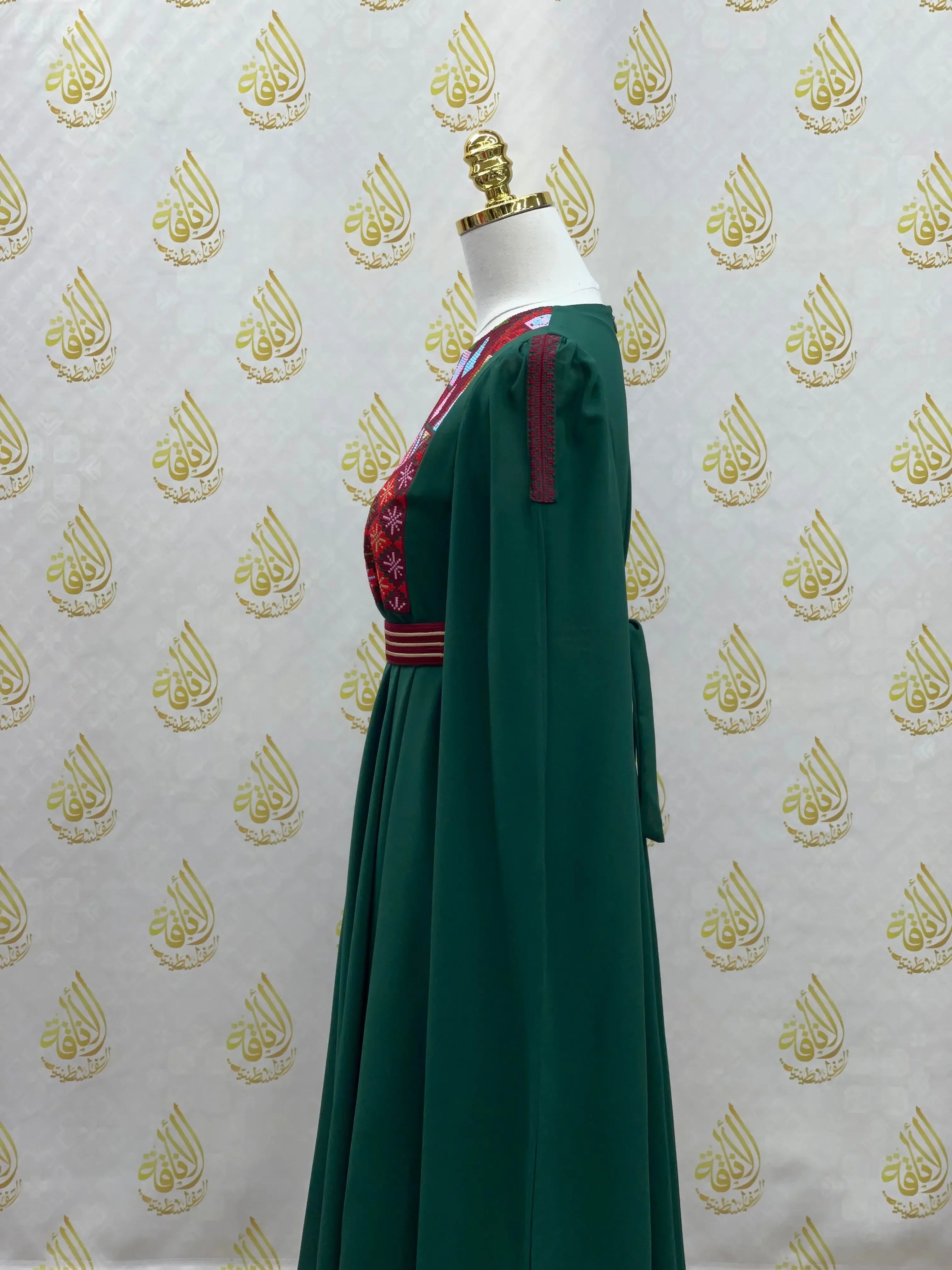 Palestinian girls embroidered dress with green fabric and red traditional embroidery on chest and waist