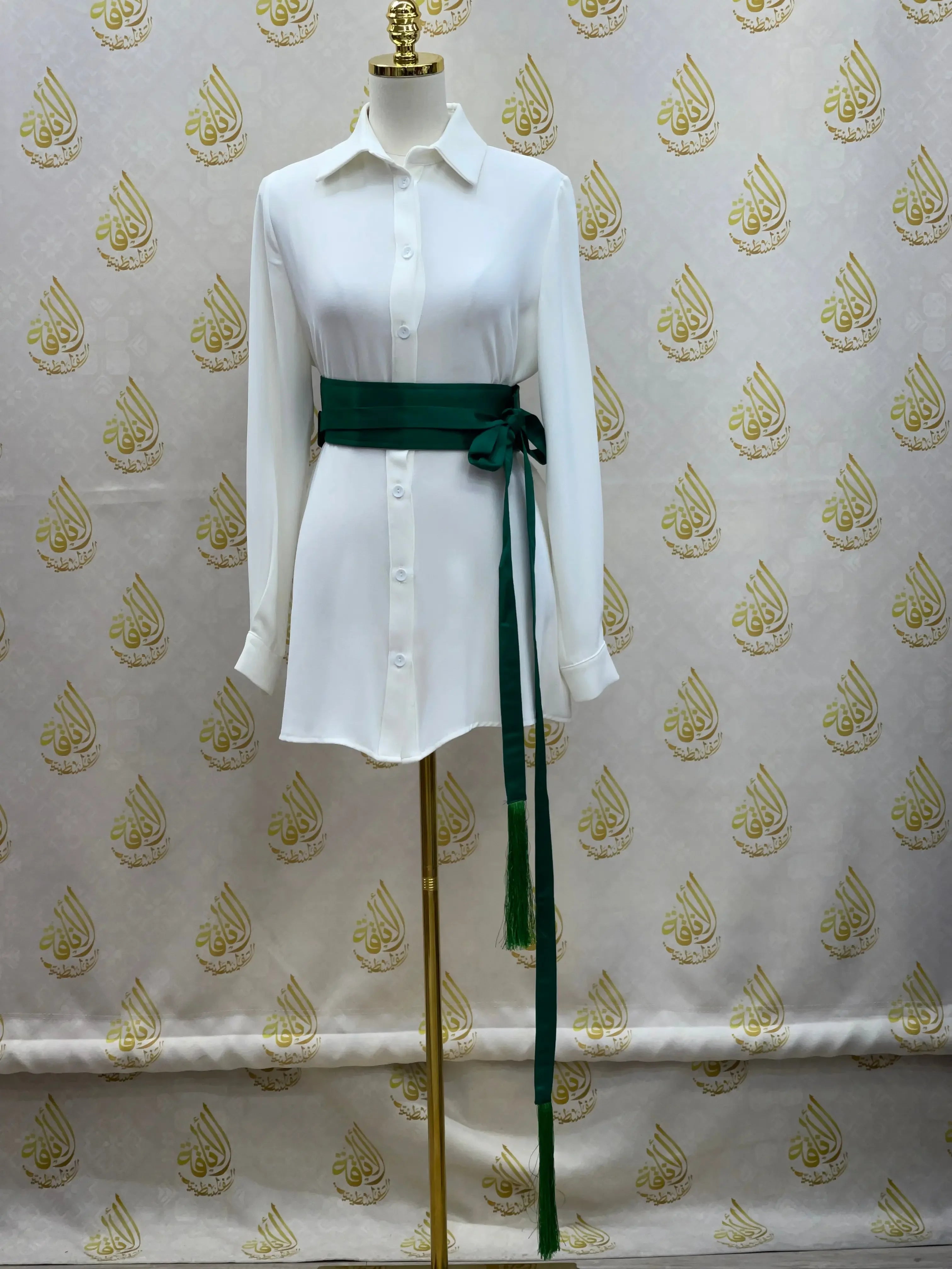 Palestinian Elegance luxury satin belt for dresses in dark green tied on white button-up shirt dress