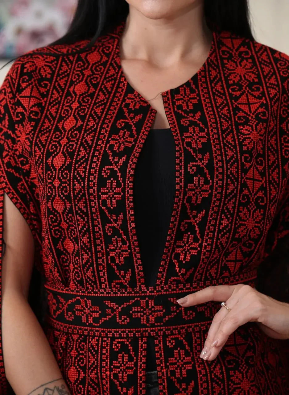 Palestinian Elegance embroidered cape jacket in black and red with traditional floral patterns