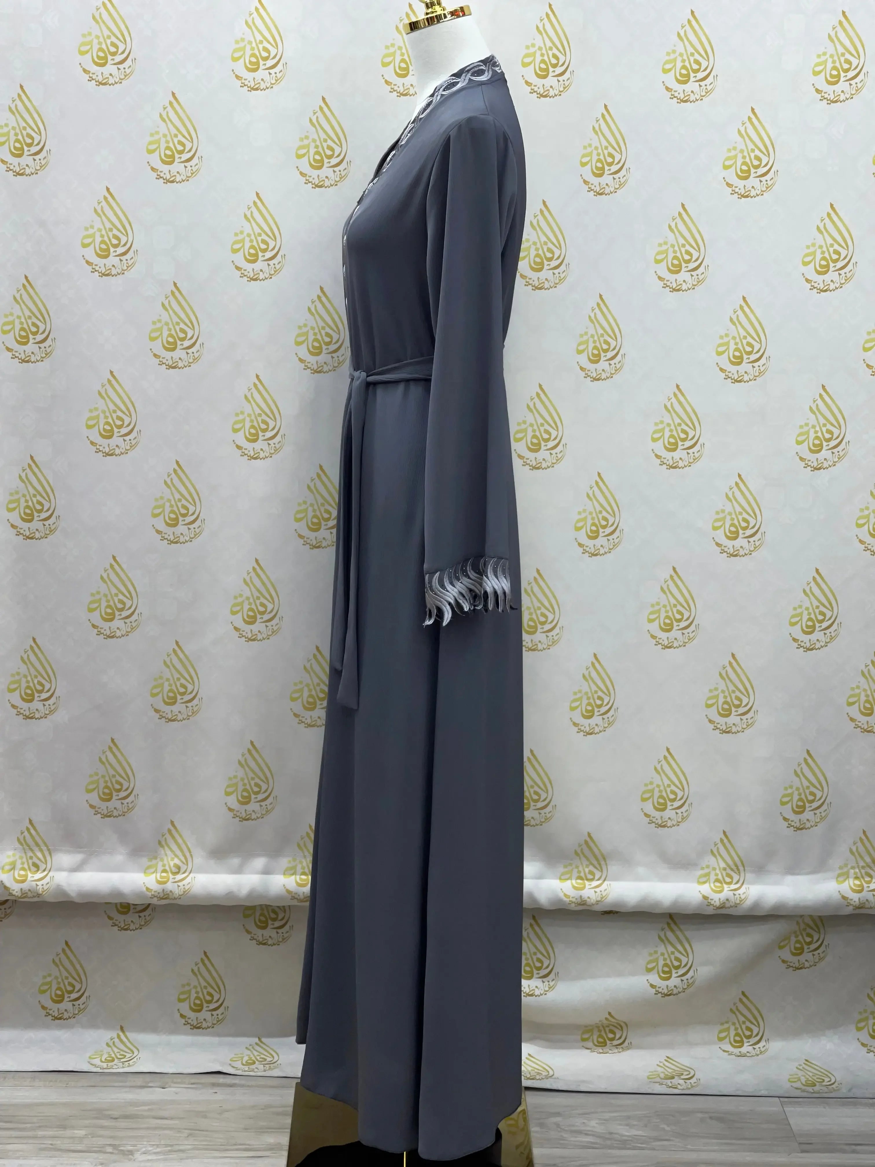 Palestinian Elegance elegant embroidered abaya in dark gray with lace details on collar and cuffs