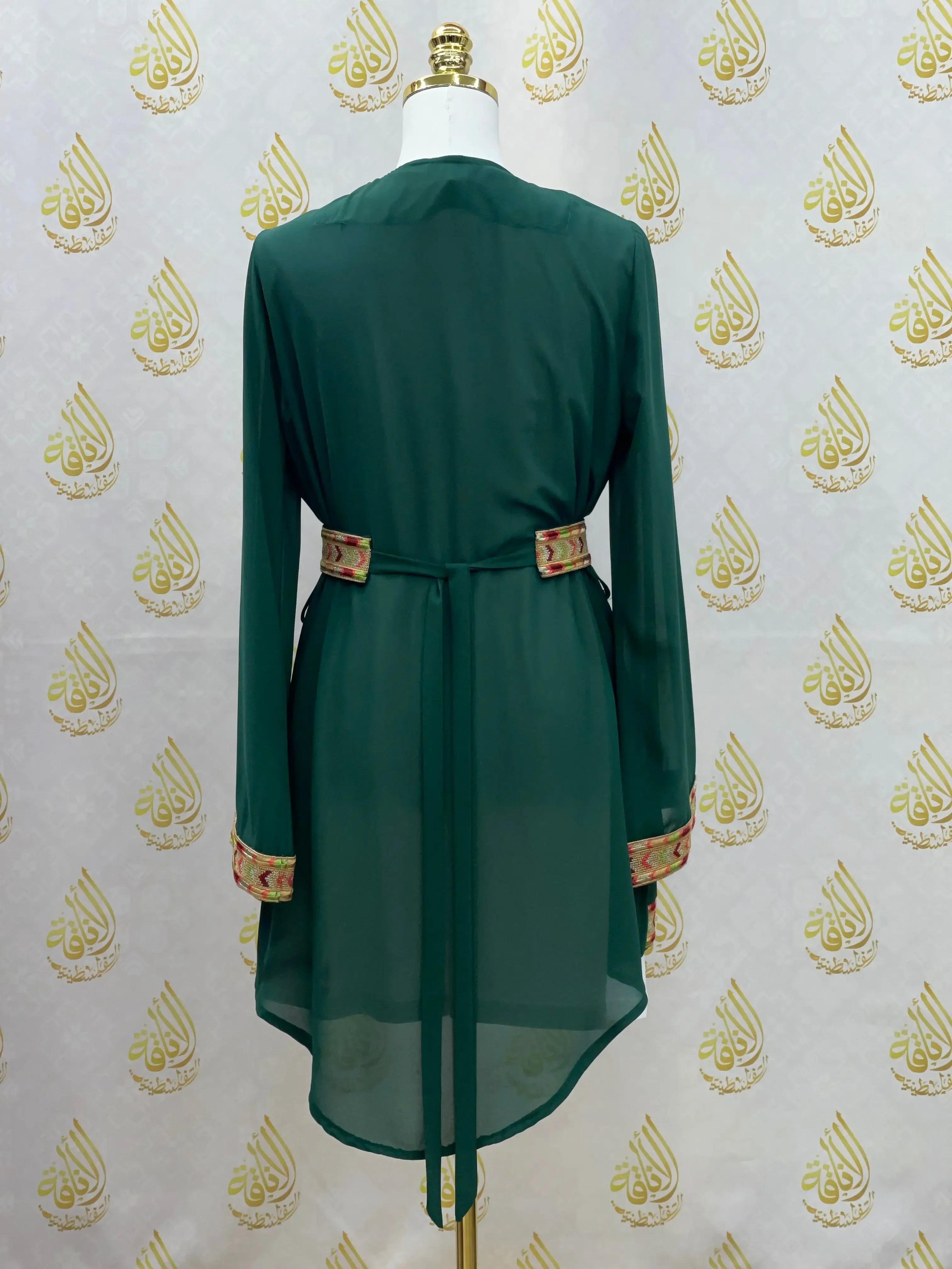 Back view of embroidered chiffon kimono cardigan in dark green with floral embroidery on cuffs and belt