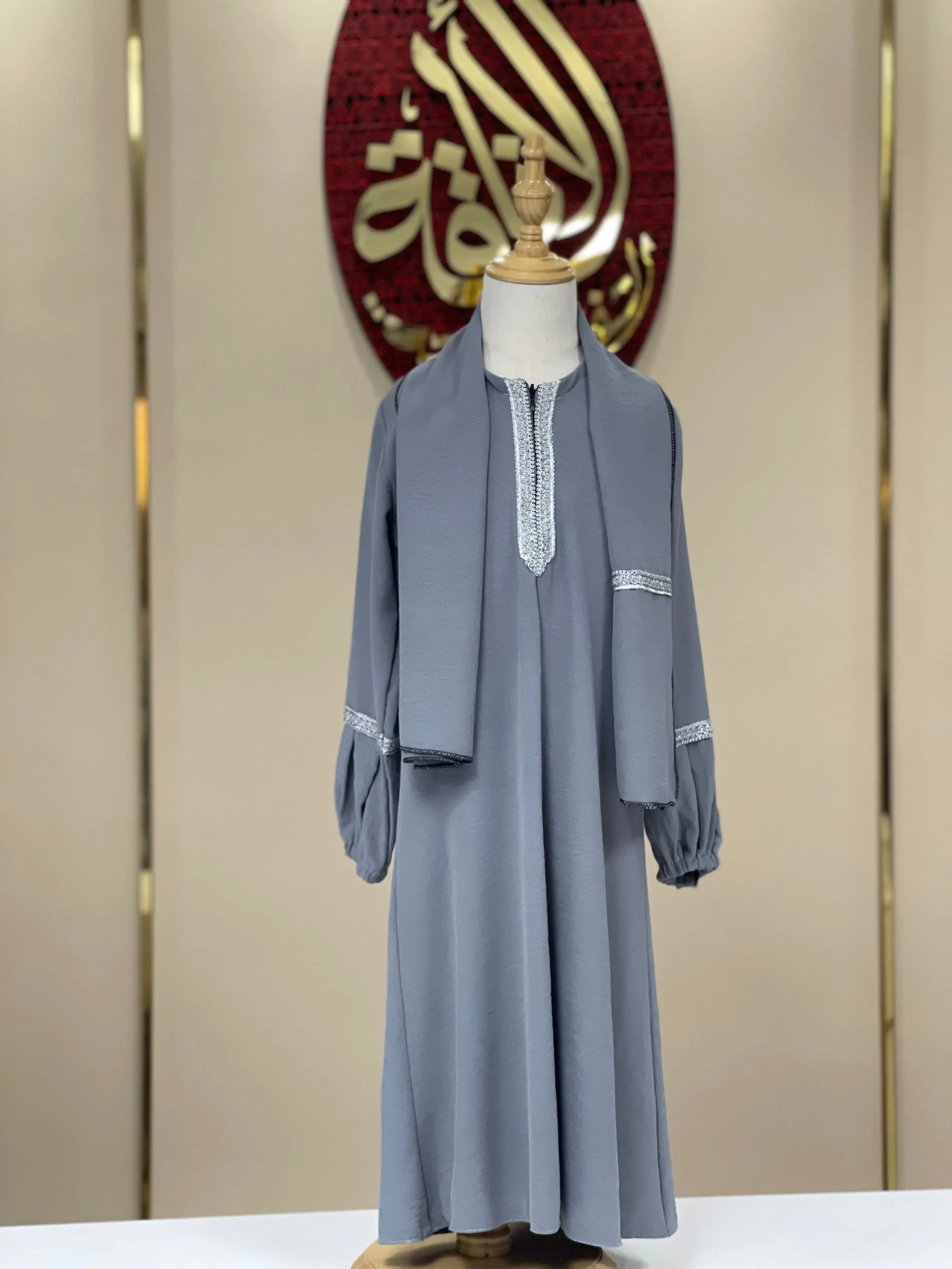 Palestinian Elegance girls embroidered abaya in gray with detailed embroidery on sleeves and neckline