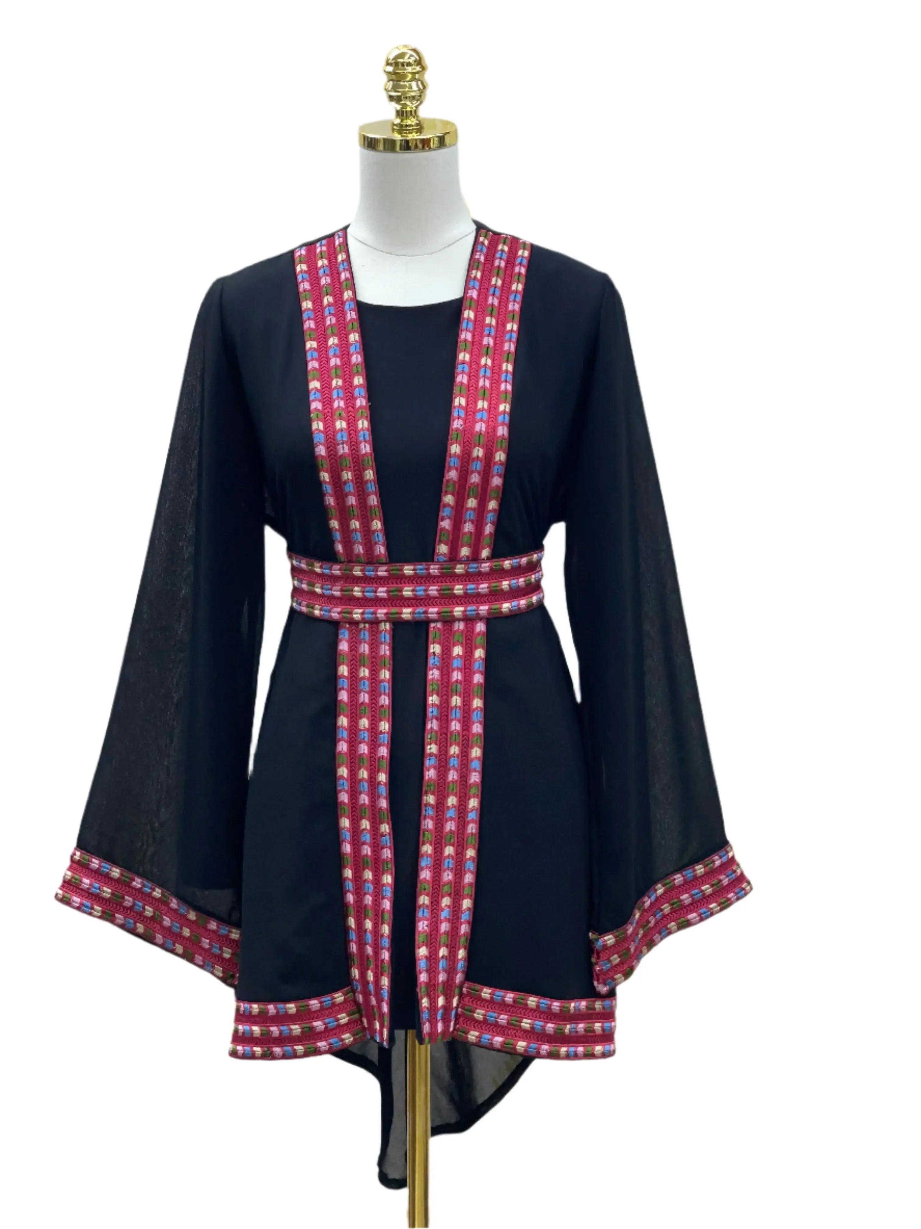 Palestinian Elegance embroidered chiffon kimono cardigan with pink and red patterned trim on black fabric
