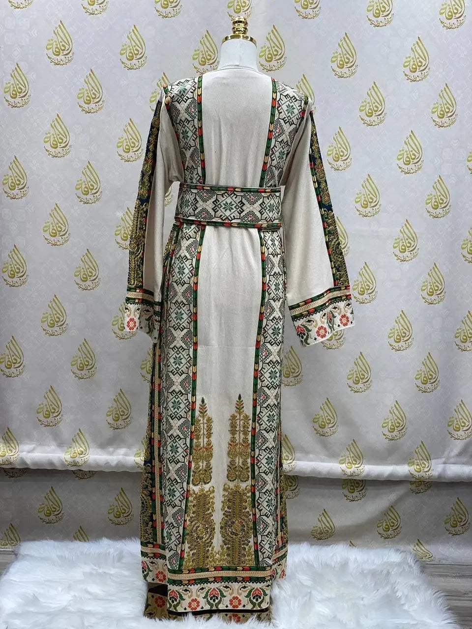 Back view of embroidered Palestinian thobe with detailed geometric and floral patterns from Palestinian Elegance