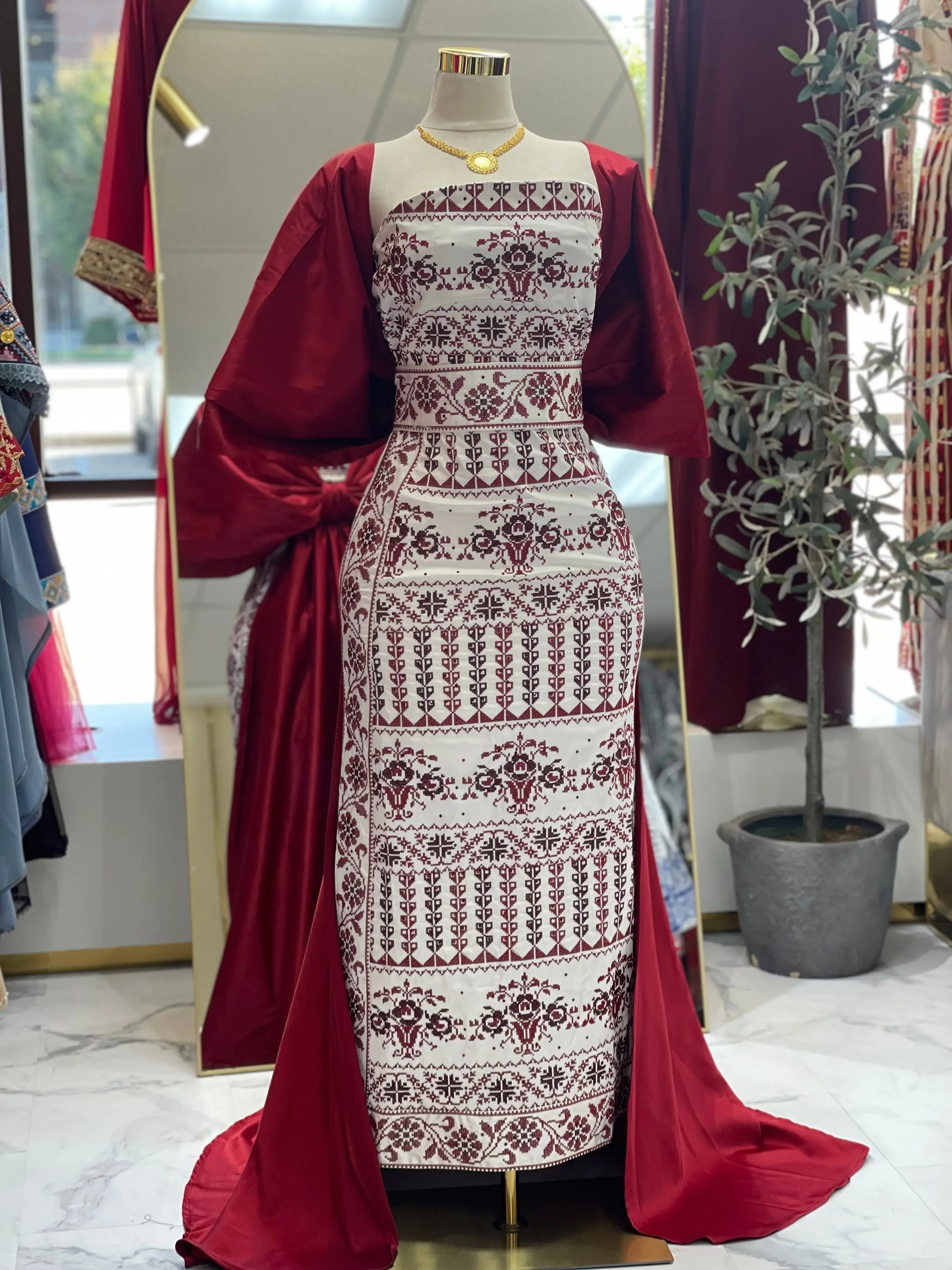 Embroidered Strapless Dress with Oversized Bow: Elegance and Sophistication Palestinian Elegance