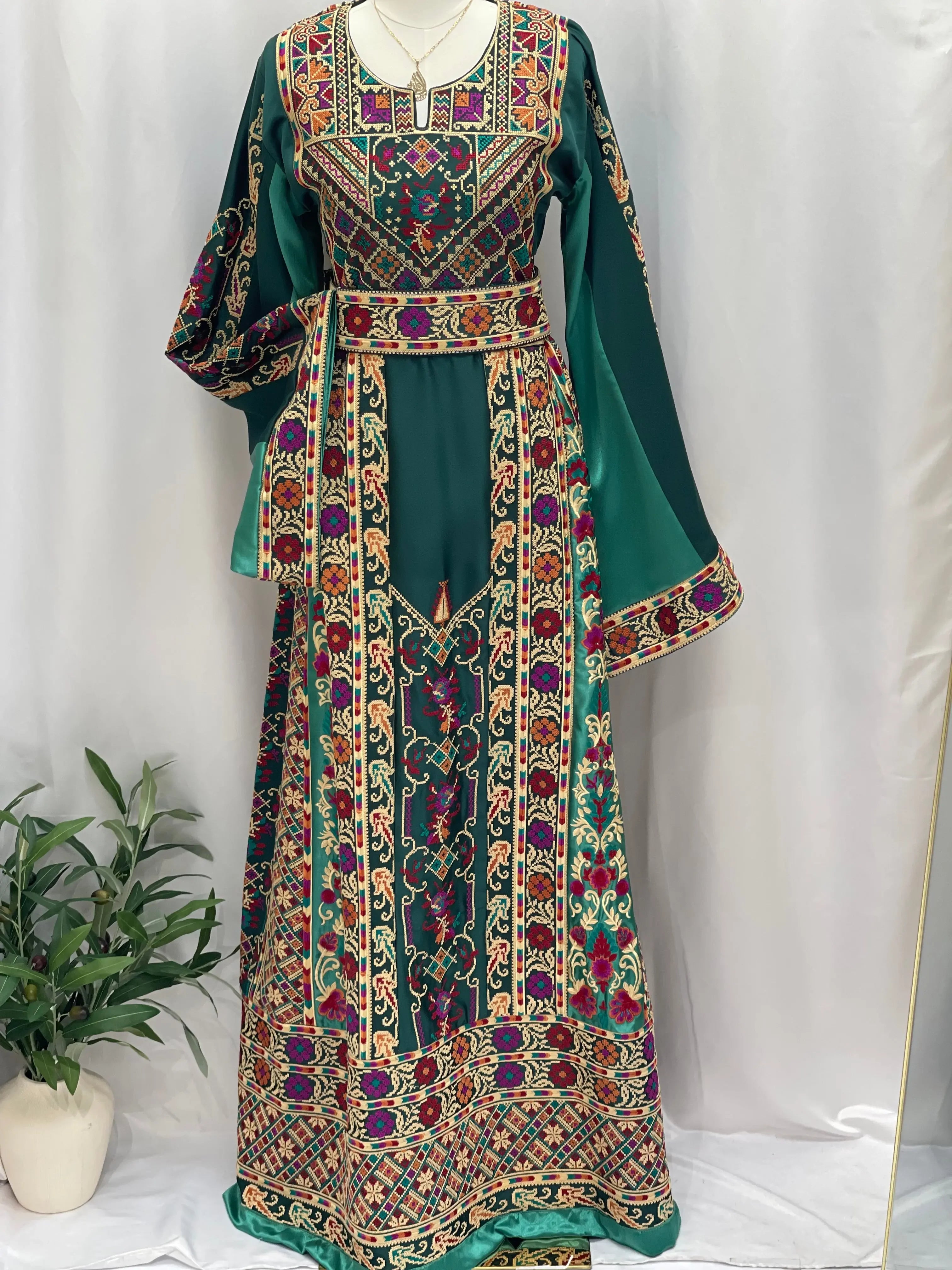Distinctive Elegance: Unique Green Satin Silk Embroidered Thoub Palestinian Elegance